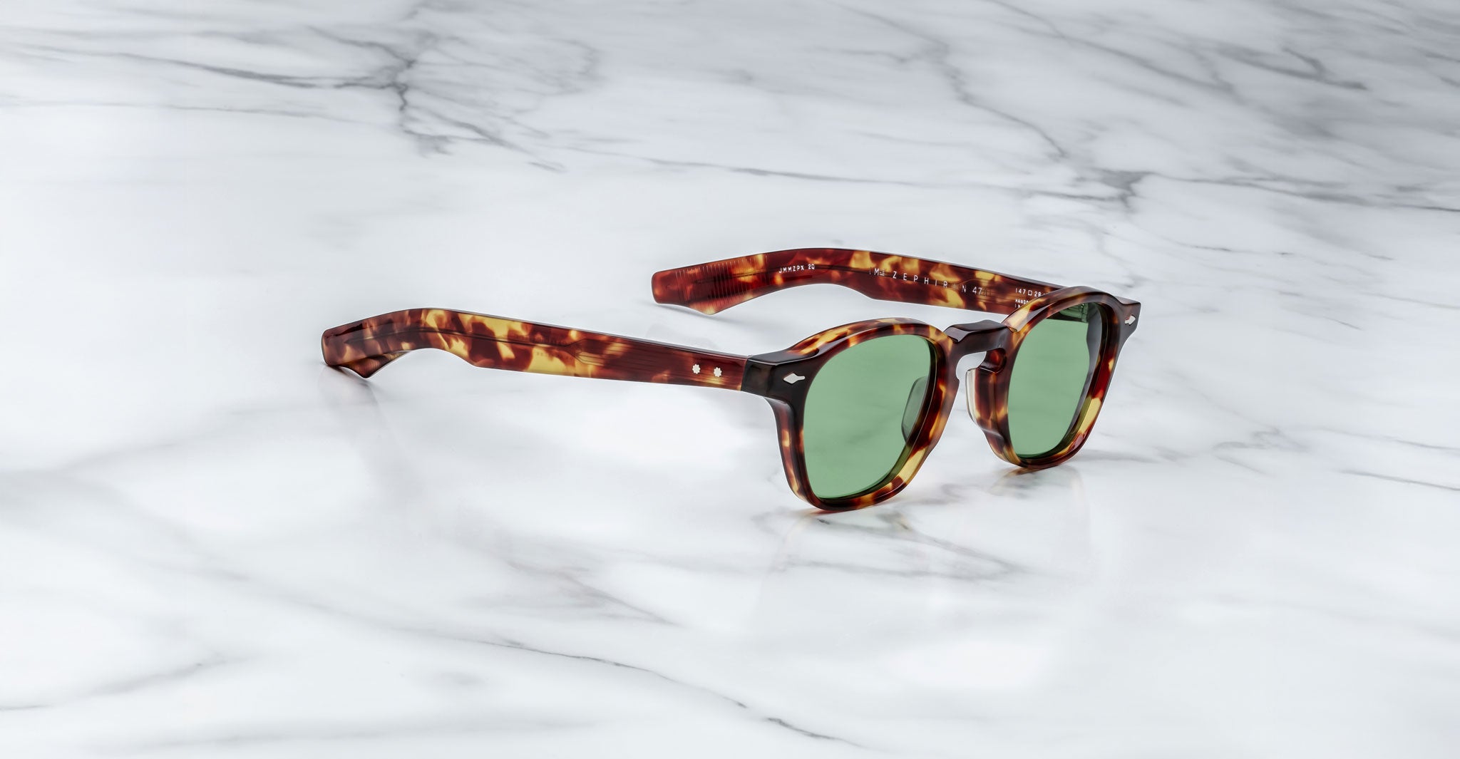 Jacques Marie Mage Zephirin 47 tortoiseshell sunglasses with green lenses, top view.