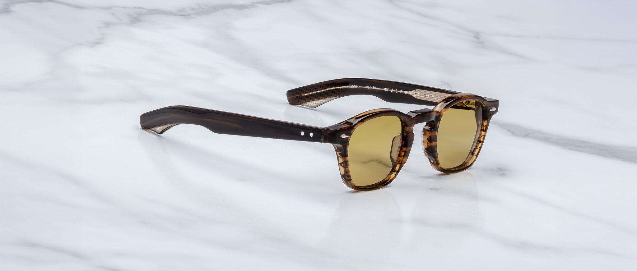 Jacques Marie Mage Zephirin 47 tortoiseshell sunglasses with yellow lenses, shown from above.