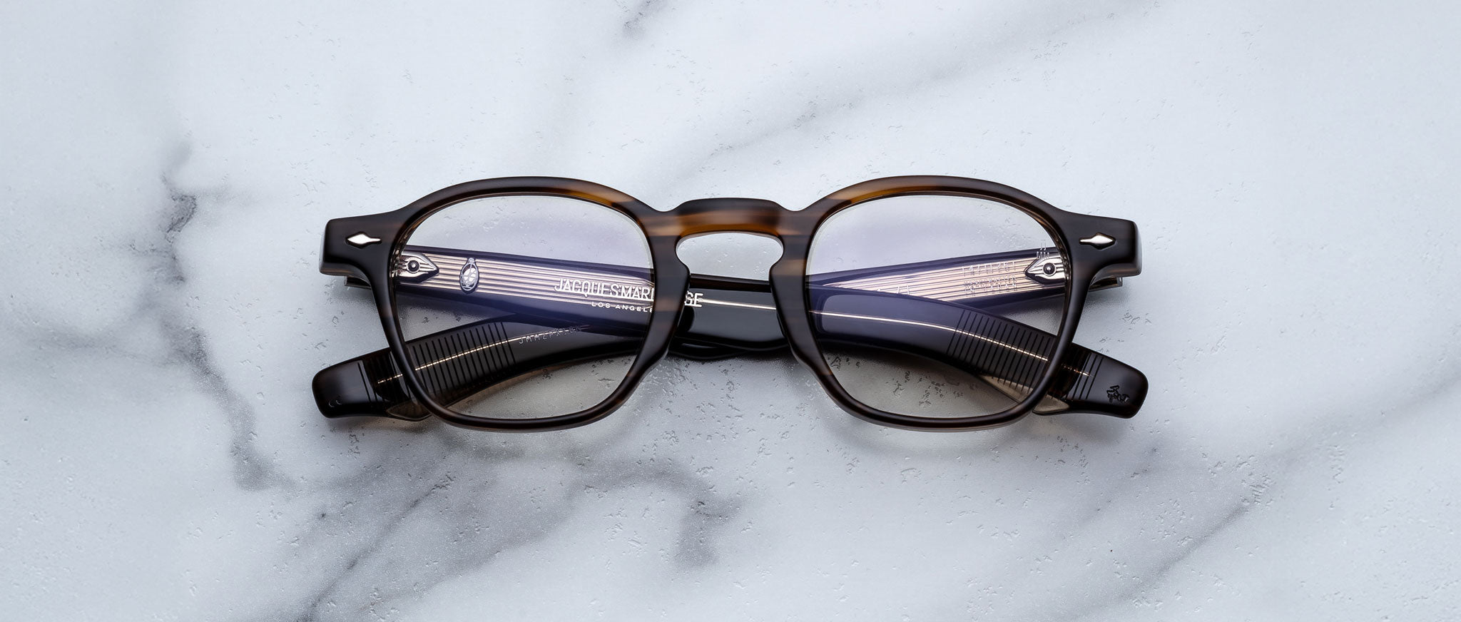 Jacques Marie Mage Zephirin 47 round eyeglasses in brown and black, front view.