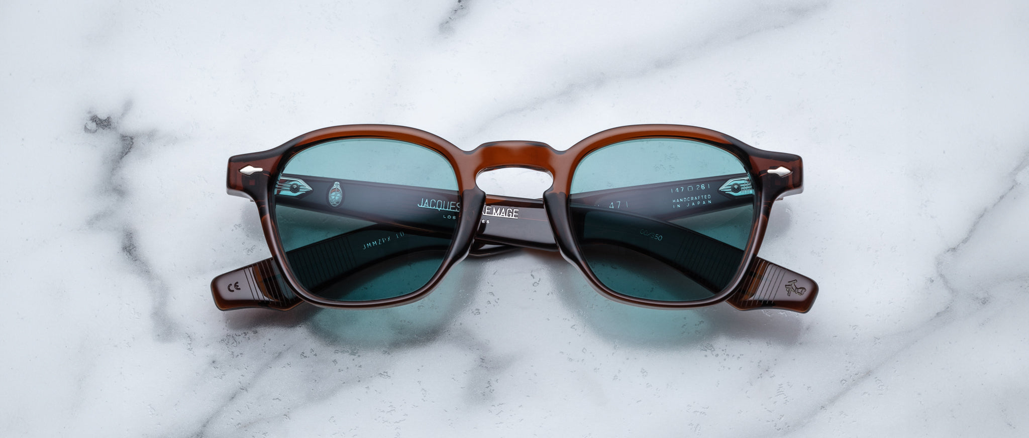 Jacques Marie Mage Zephirin 47 brown sunglasses with blue-green lenses, front view.