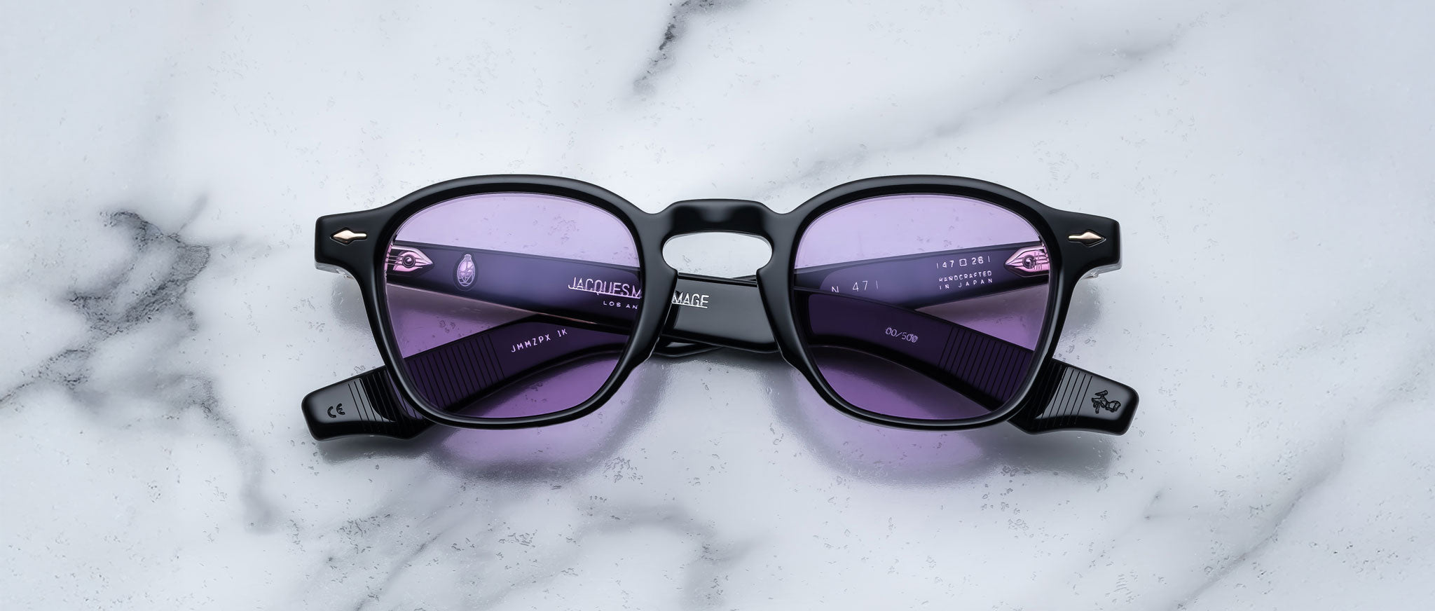 Jacques Marie Mage Zephirin 47 sunglasses with purple-tinted lenses shown from above.