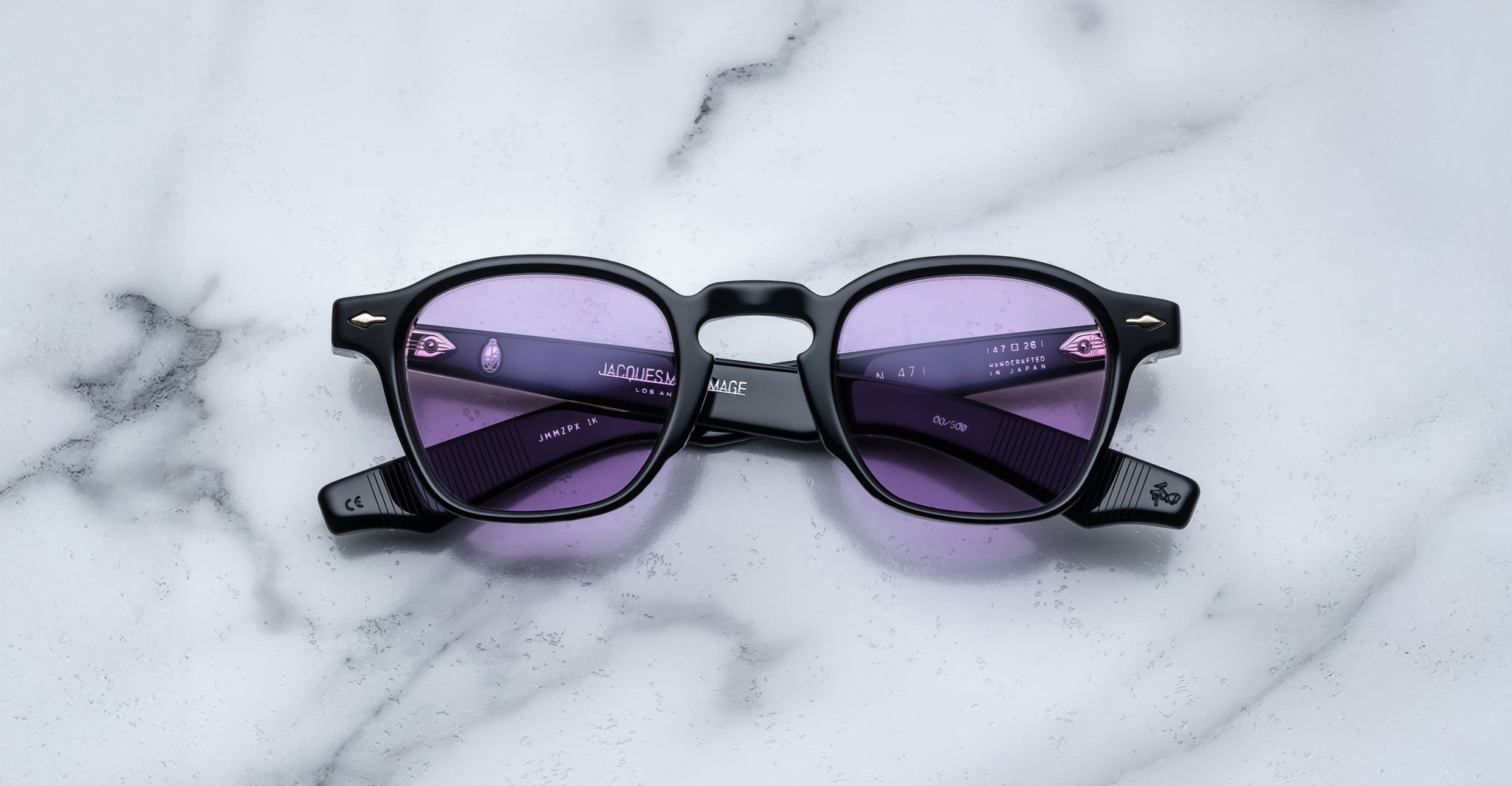 Jacques Marie Mage Zephirin 47 sunglasses with purple-tinted lenses shown from above.