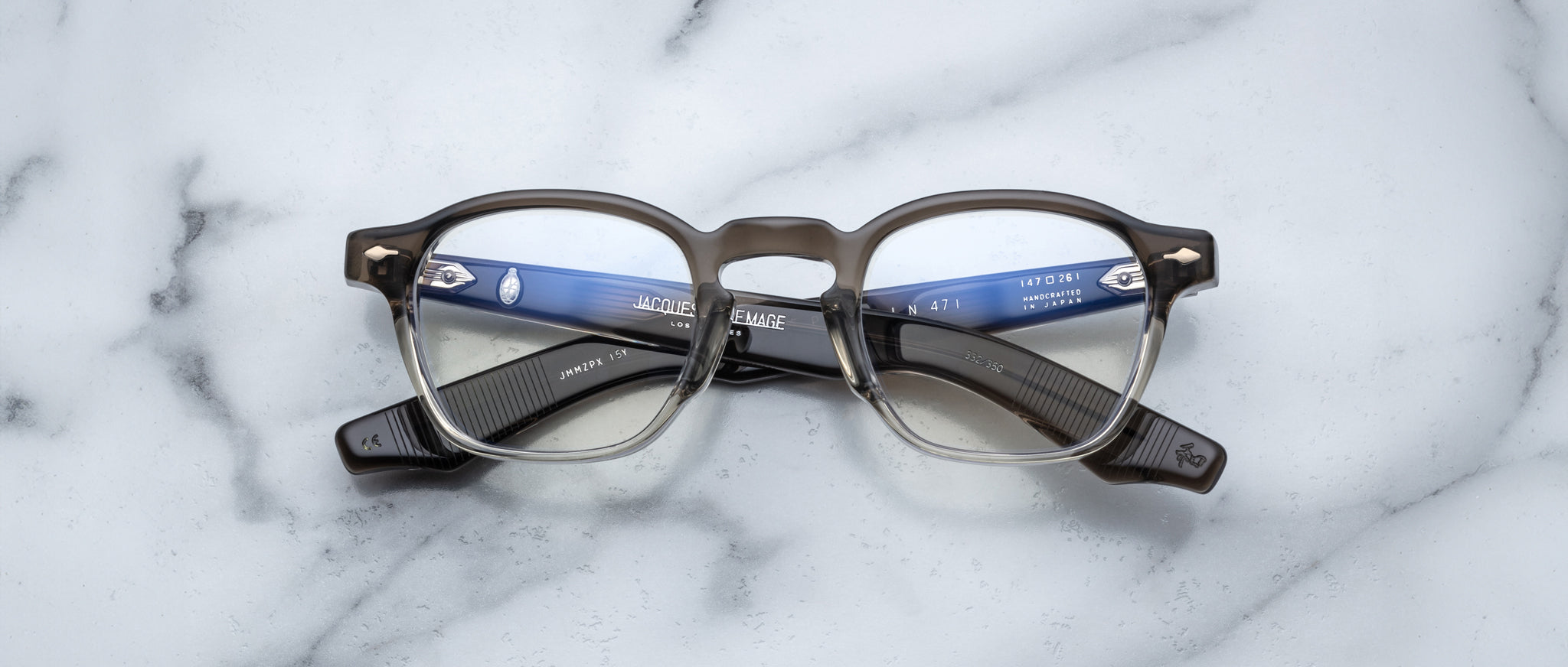 Jacques Marie Mage Zephirin 47 round eyeglasses, black and clear frame, front angle view.