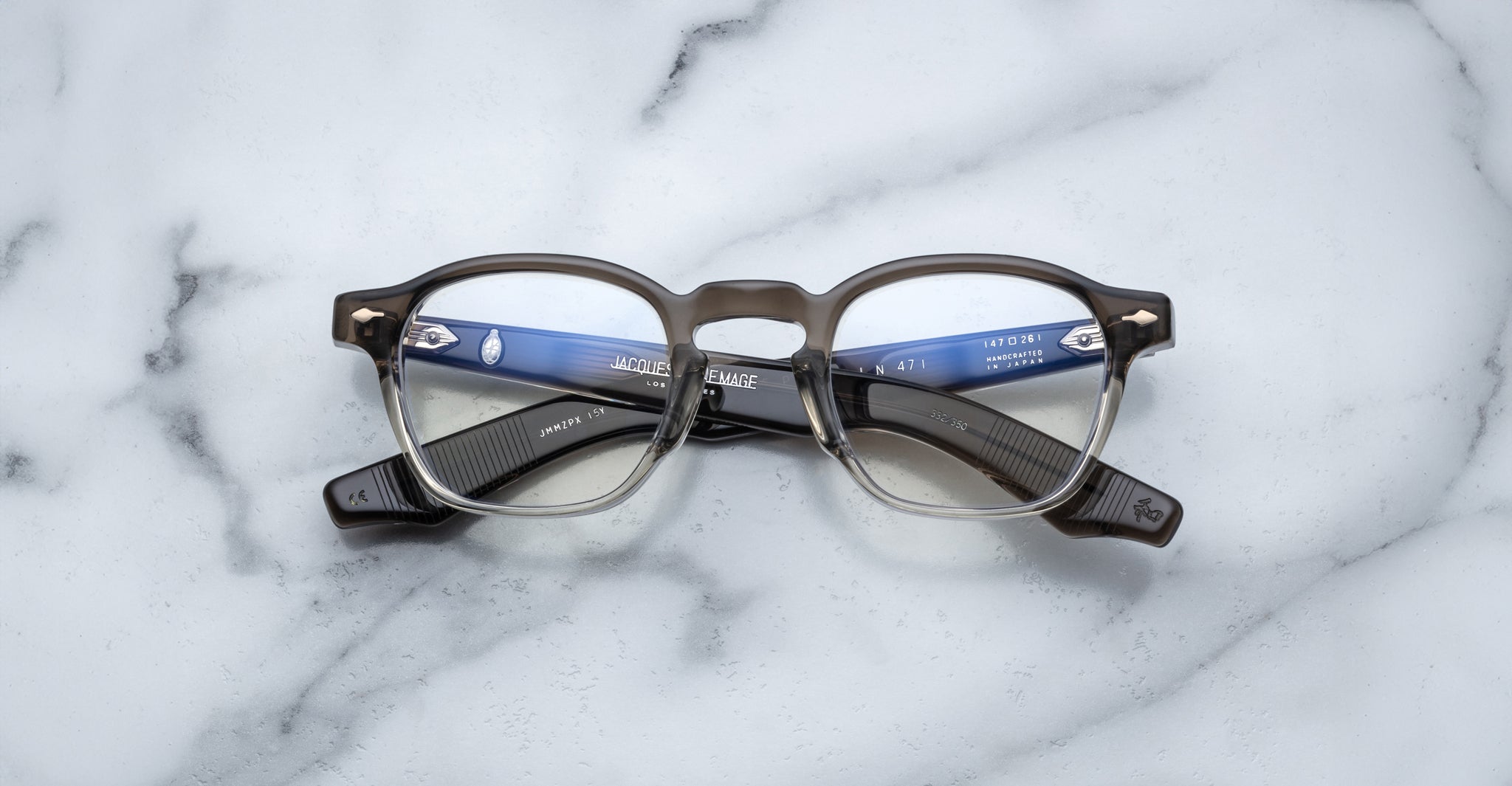 Jacques Marie Mage Zephirin 47 round eyeglasses, black and clear frame, front angle view.