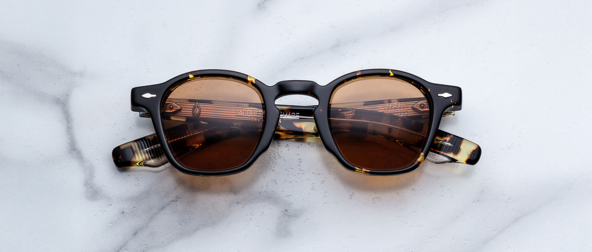 Jacques Marie Mage Zephirin in Tokyo round tortoiseshell sunglasses with UV-protected brown lenses, top view.