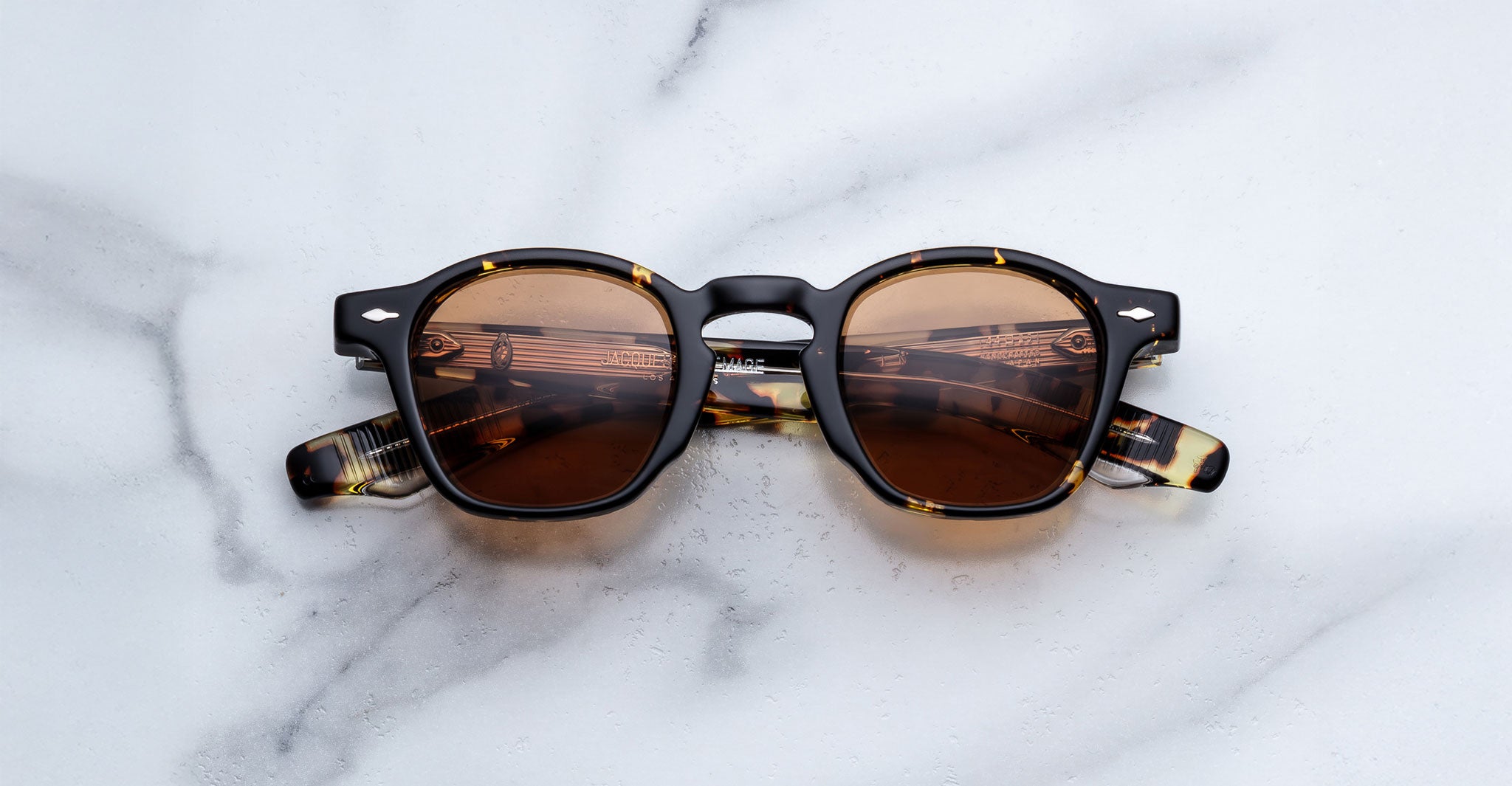 Jacques Marie Mage Zephirin in Tokyo round tortoiseshell sunglasses with UV-protected brown lenses, top view.