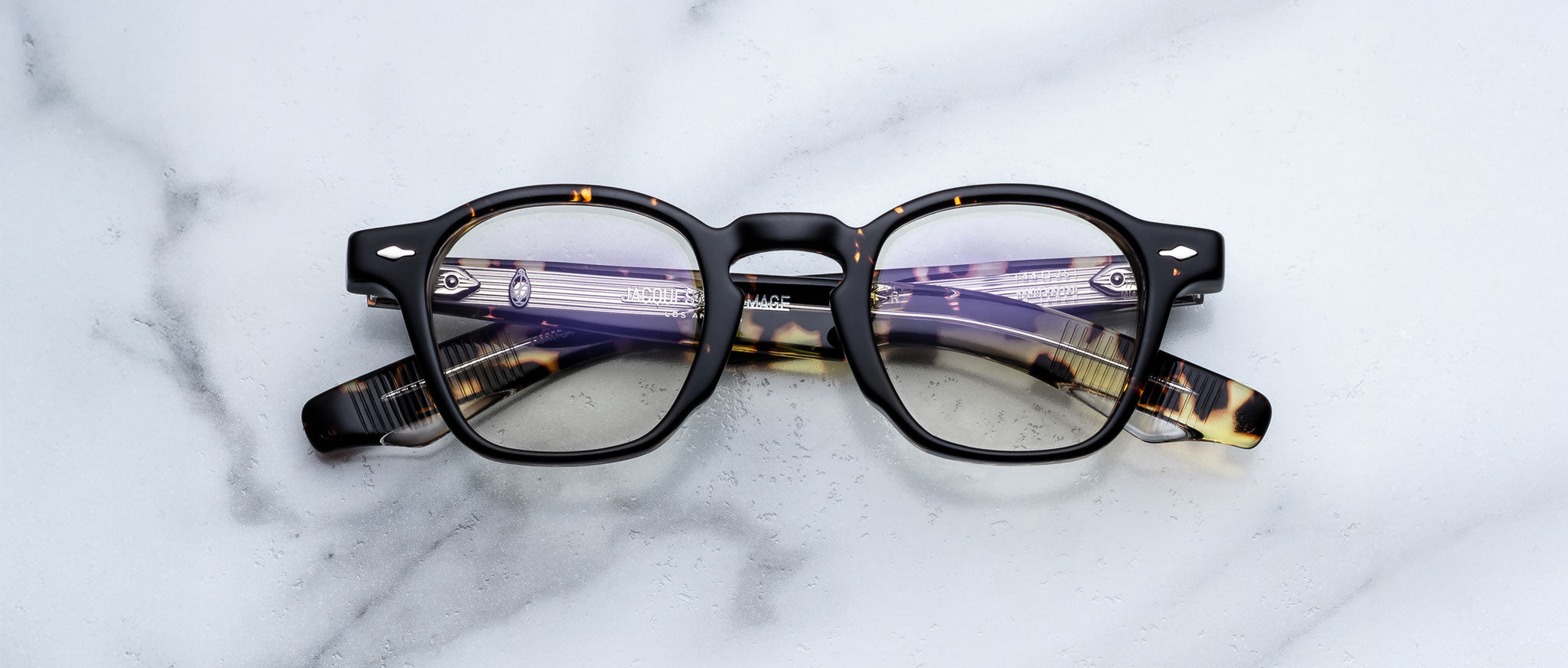 Jacques Marie Mage Zephirin in Tokyo round tortoiseshell eyeglasses with black accents, top view.