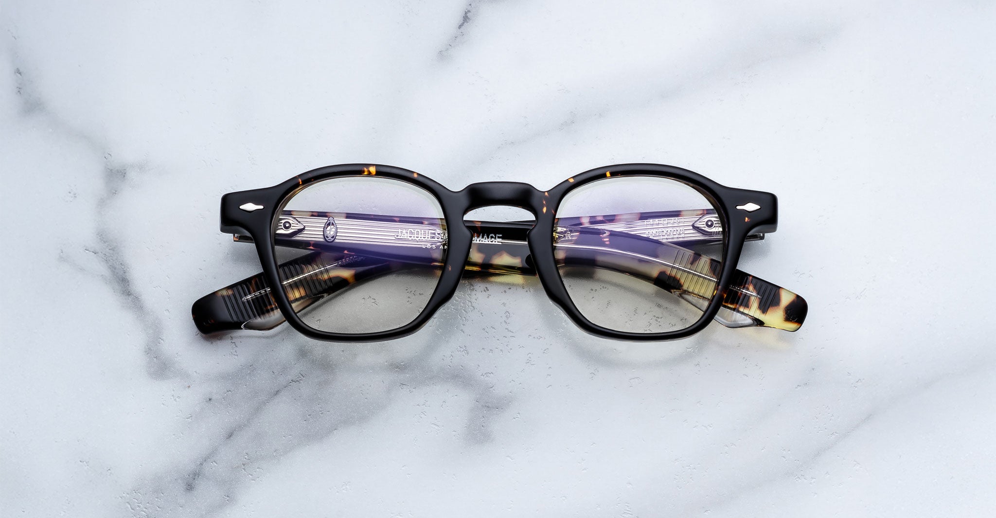 Jacques Marie Mage Zephirin in Tokyo round tortoiseshell eyeglasses with black accents, top view.