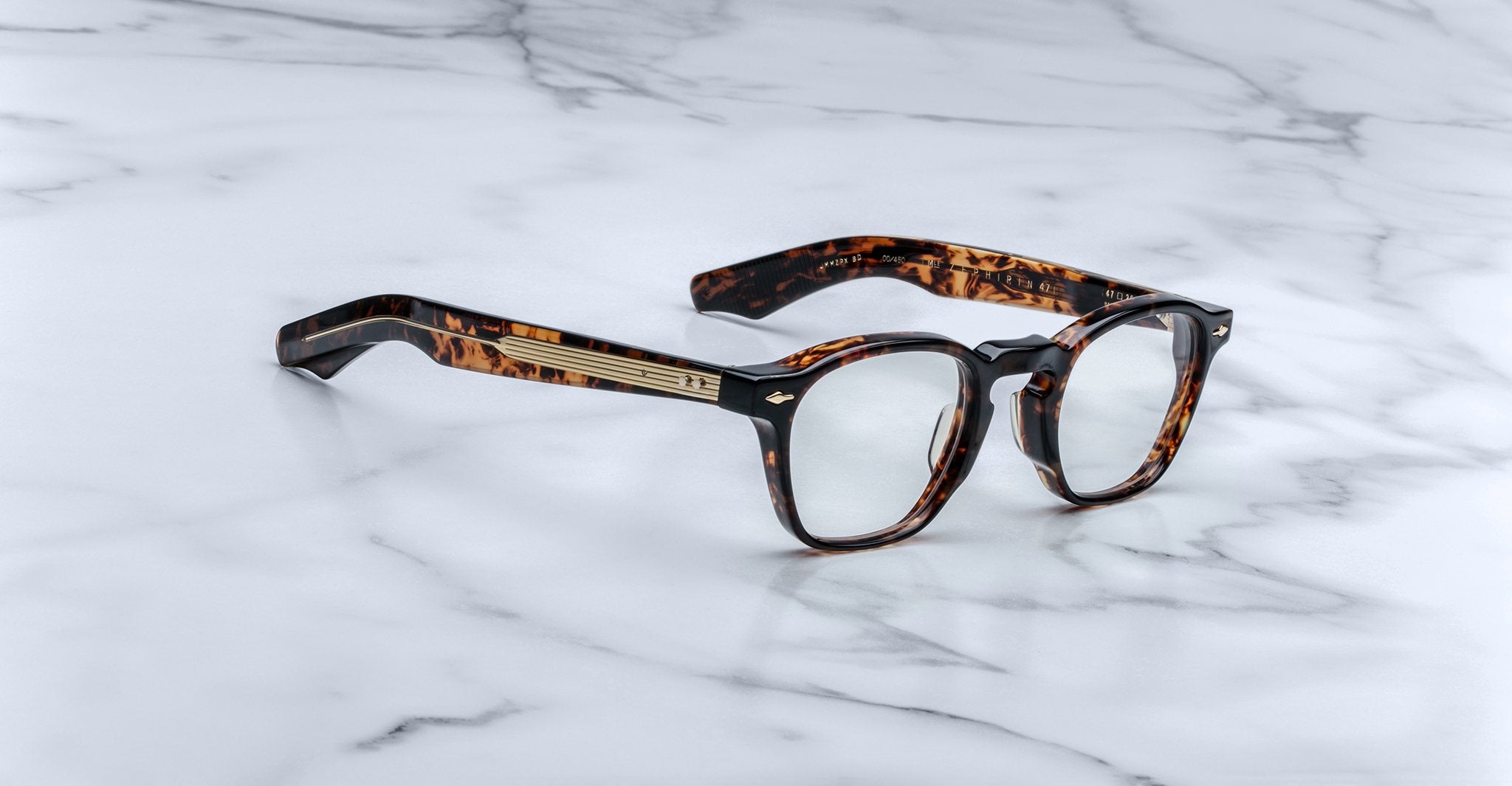 Jacques Marie Mage Zephirin 47 round tortoiseshell eyeglasses with gold accents, viewed from above.