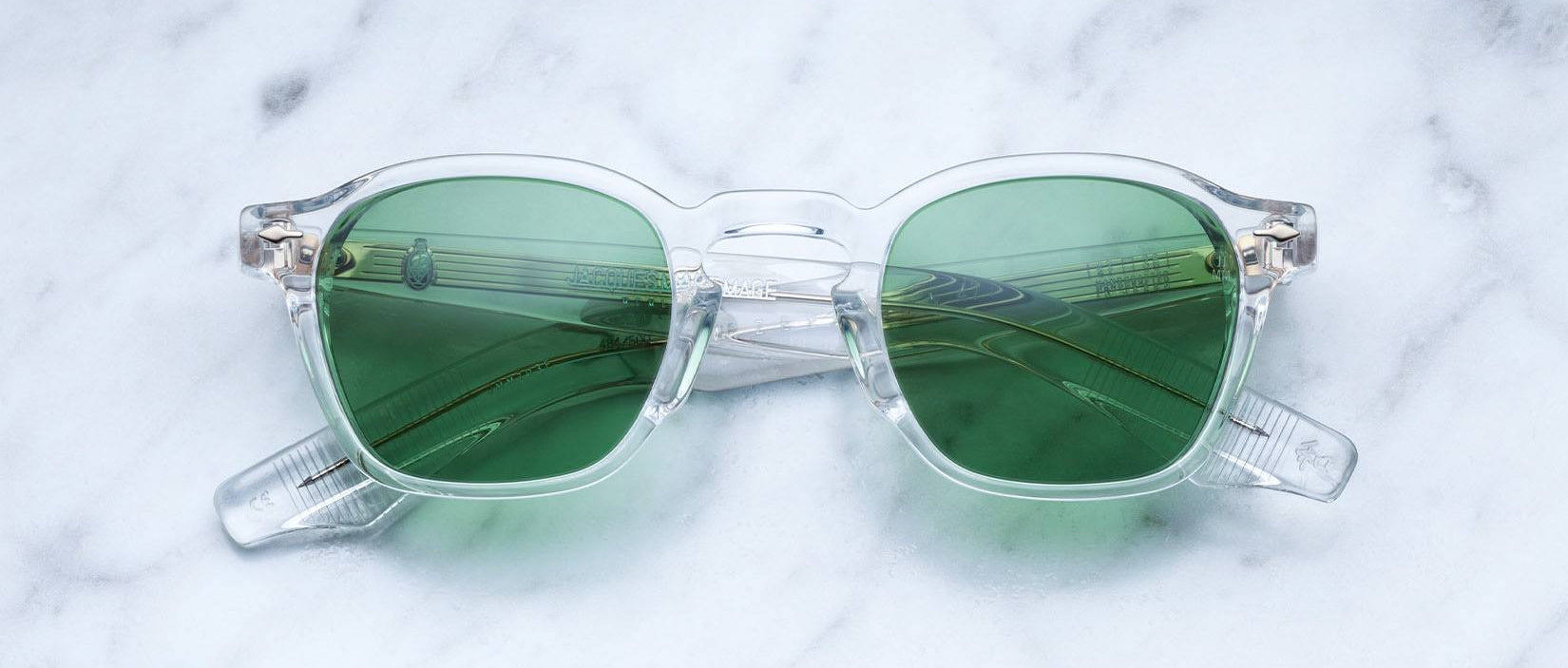 Jacques Marie Mage Zephirin 47 in Clear 2 sunglasses with green lenses shown from above.