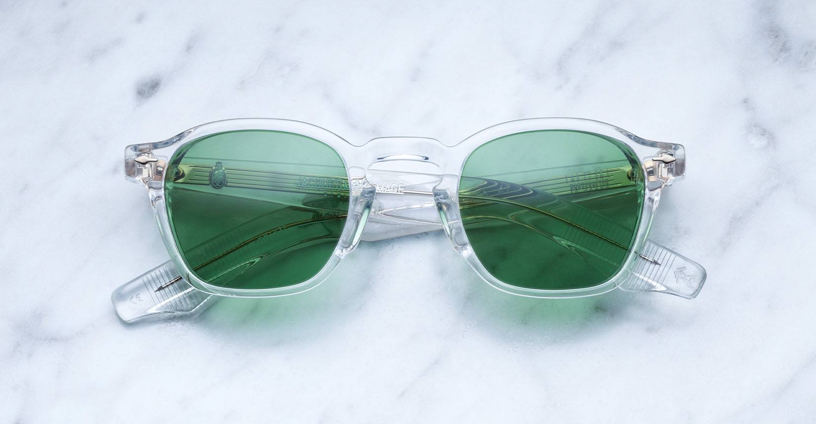 Jacques Marie Mage Zephirin 47 in Clear 2 sunglasses with green lenses shown from above.