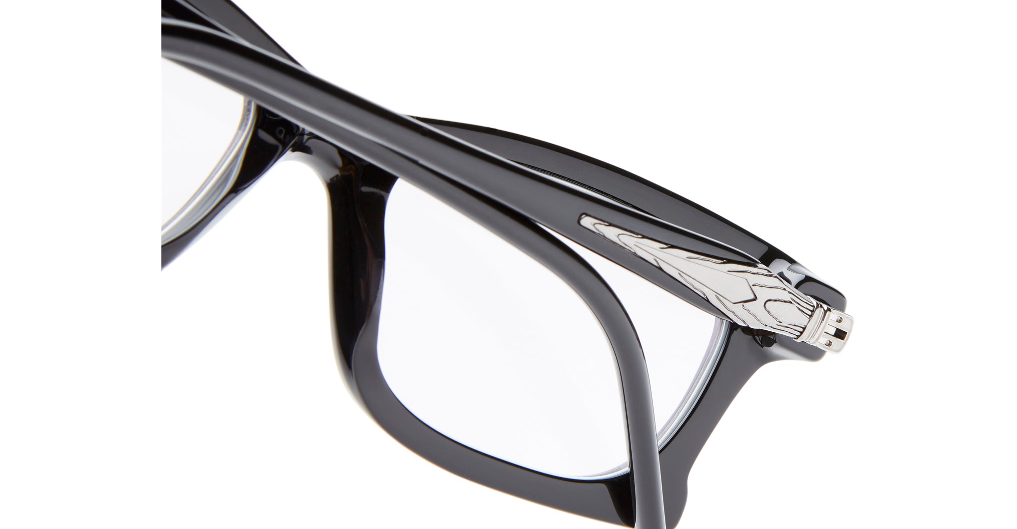 Close-up of Kuboraum D75 black eyeglass frames with a glossy finish and clear lenses, featuring a silver metallic Iron Man helmet detail on the temple.