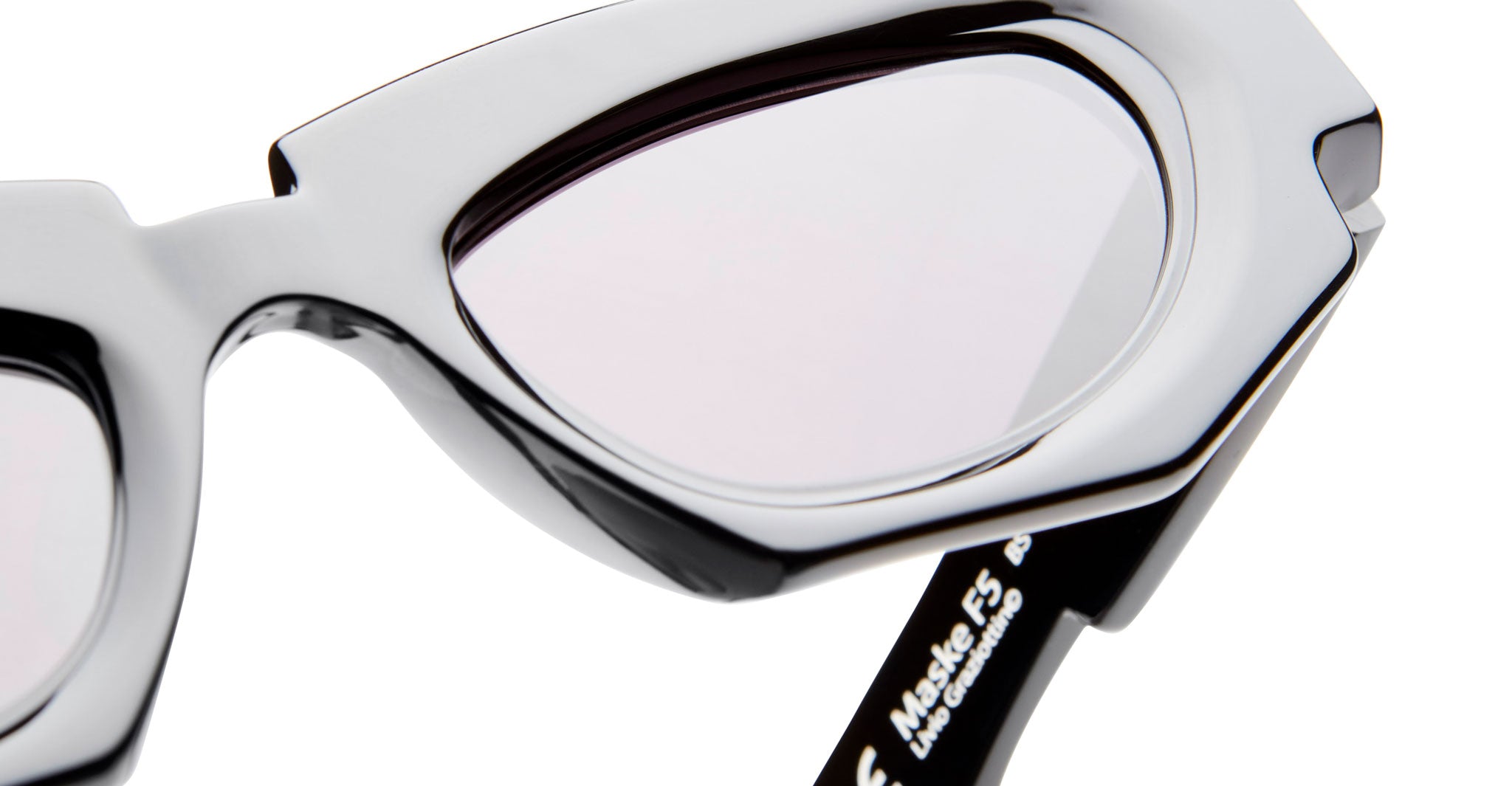 Close-up of Kuboraum F5 eyeglasses by KUBORAUM, featuring geometric clear frames and lenses, front view.