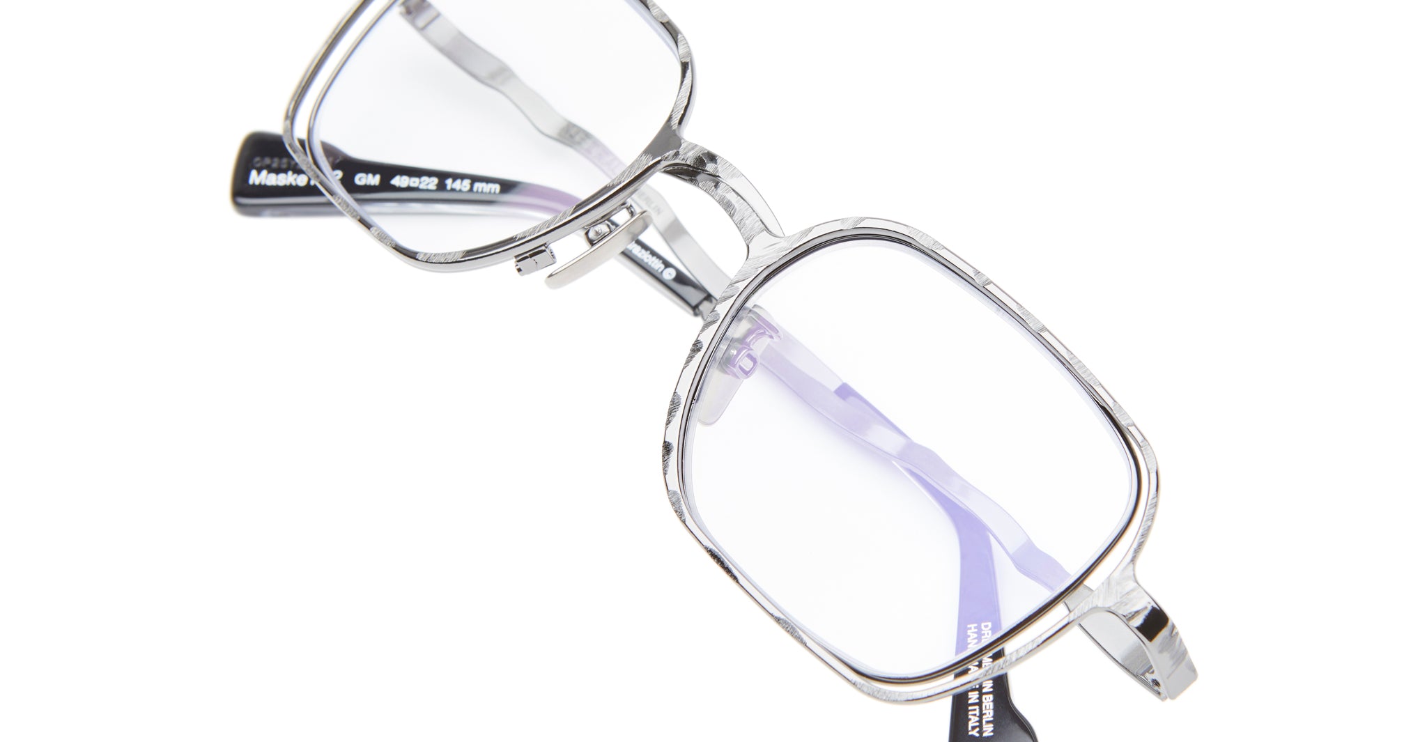 The Kuboraum H22 is a pair of silver, rectangular eyeglasses with clear lenses and black temple tips, displayed on a white background.