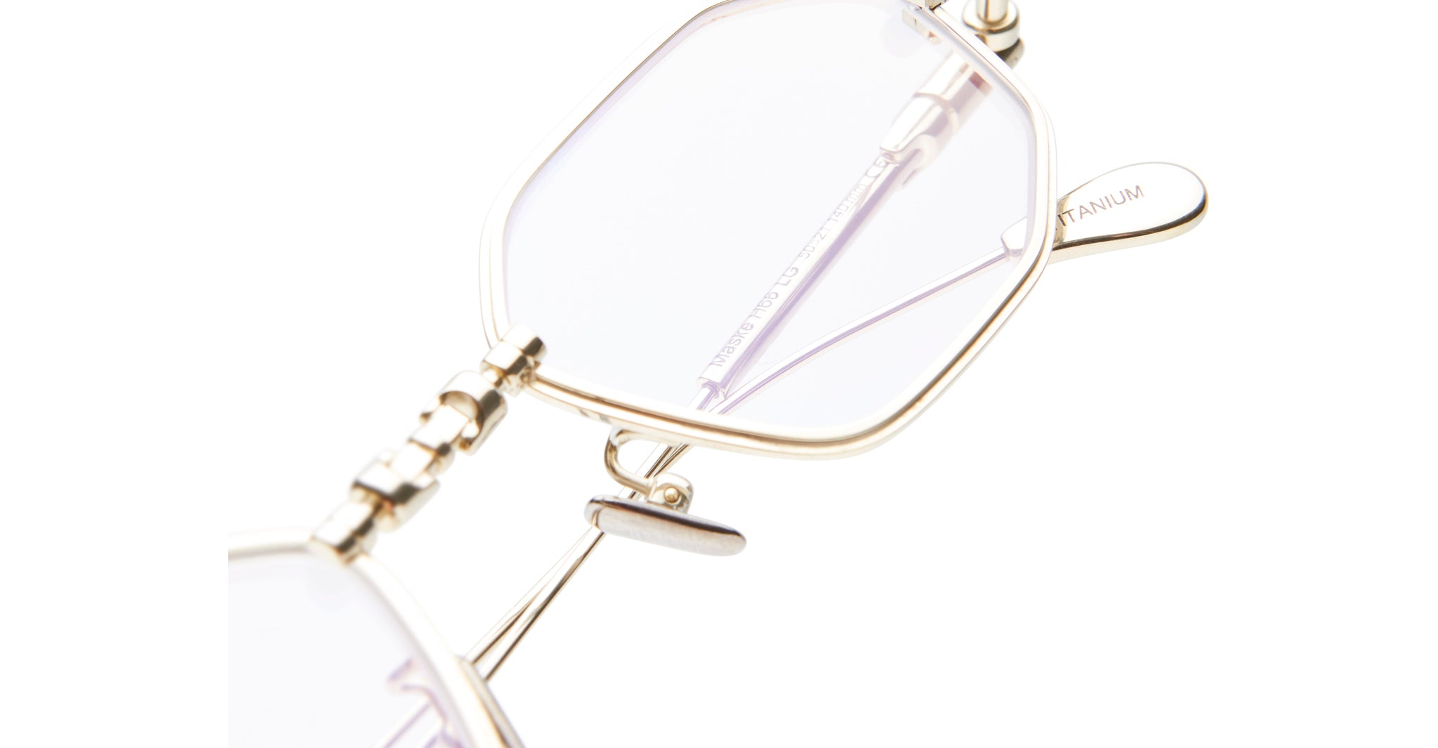 Close-up of KUBORAUM H66 gold titanium eyeglasses with clear lenses, featuring minimalist design, viewed from the front.