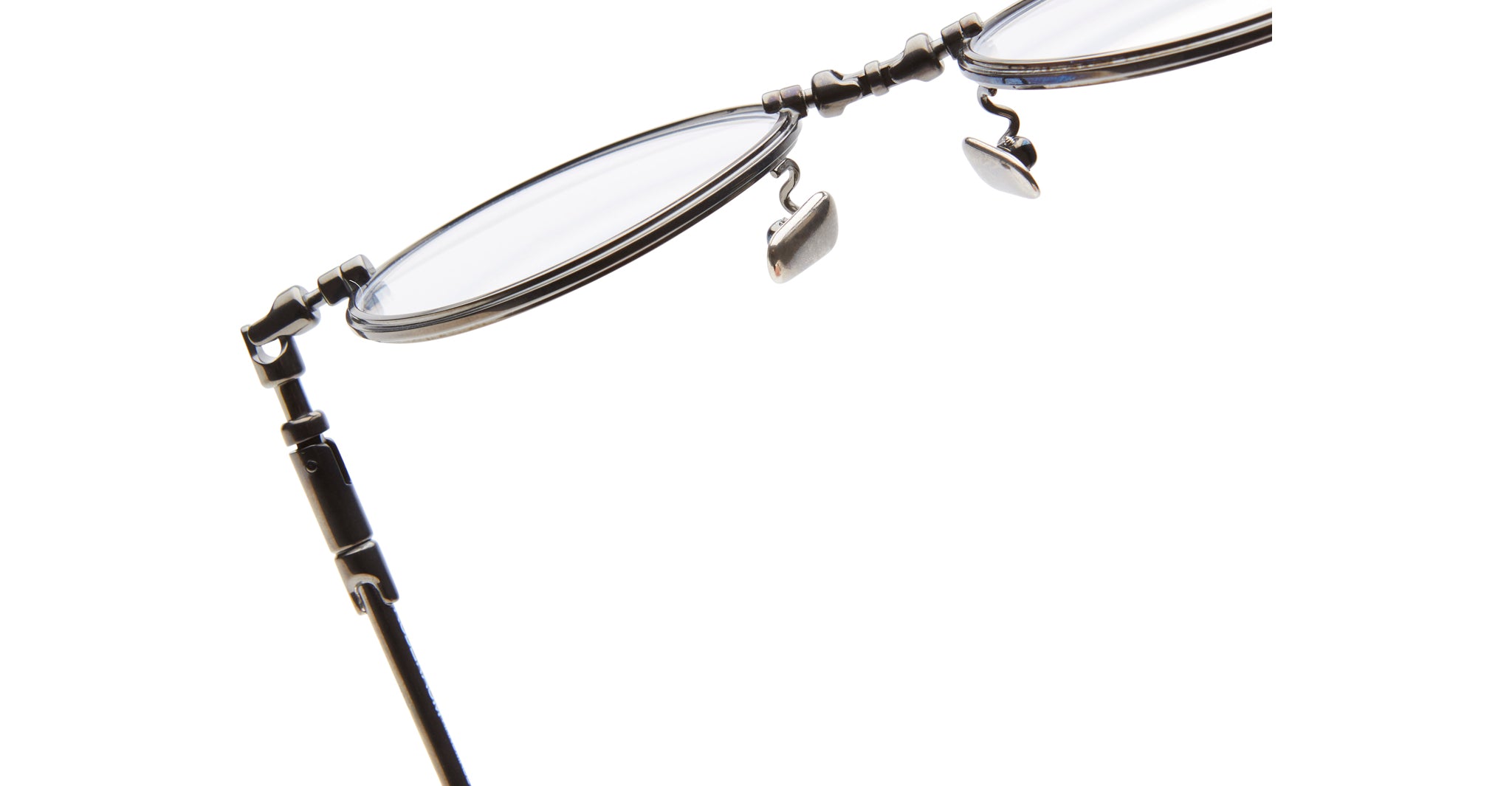 Close-up view of KUBORAUM H67 eyeglasses showing thin metal rims, hinge detail, and adjustable nose pads.