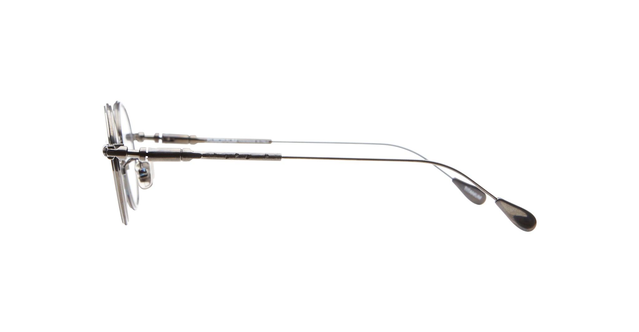 Side view of Kuboraum H67 round metal eyeglasses featuring thin temples and black plastic temple tips.