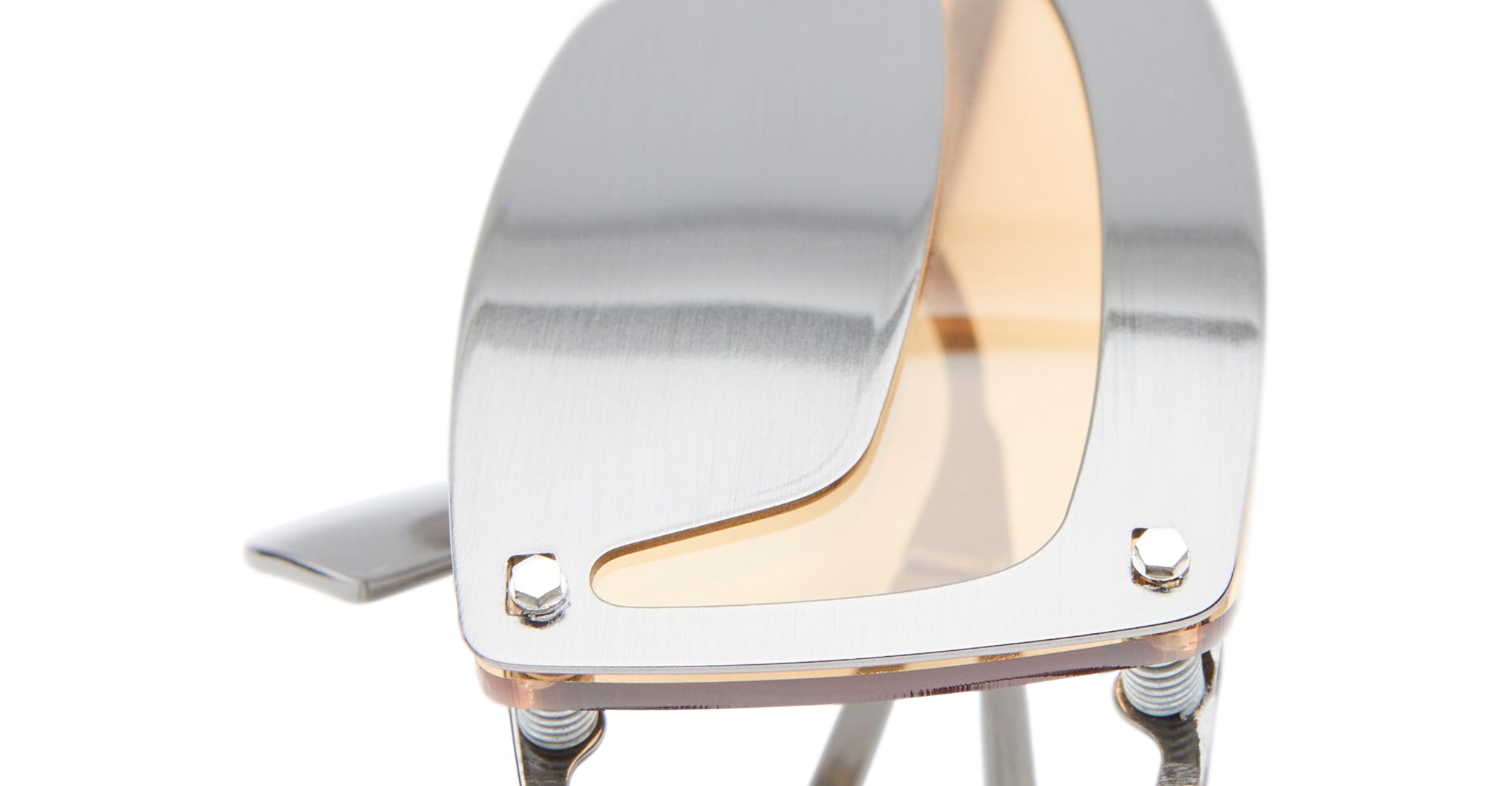 Close-up of the Kuboraum I50, showcasing its brushed silver finish, visible screws, a translucent beige-tinted inset panel, and a sleek, curved layered design with underlying metal elements.