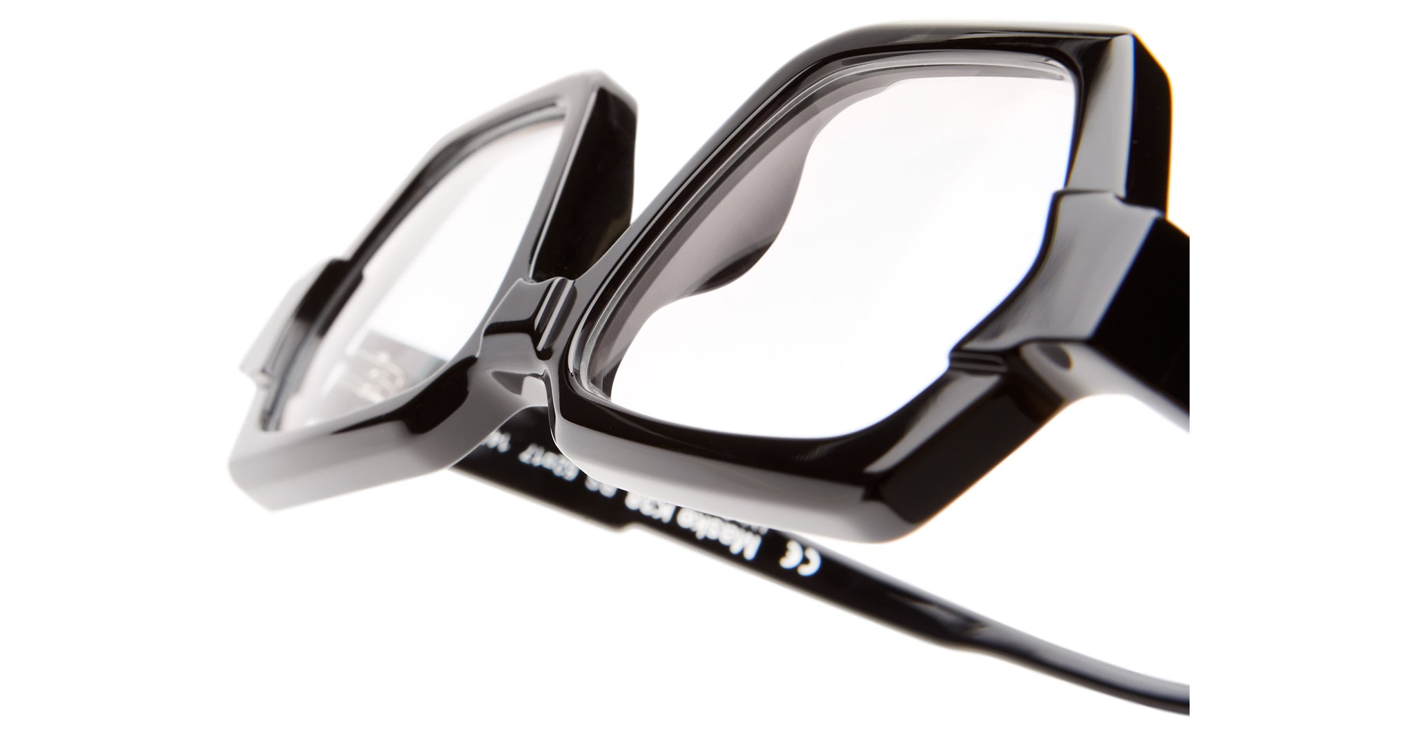 Close-up view of the Kuboraum K38 thick black rectangular eyeglass frames, showcasing the front and part of the temple arm against a white background.