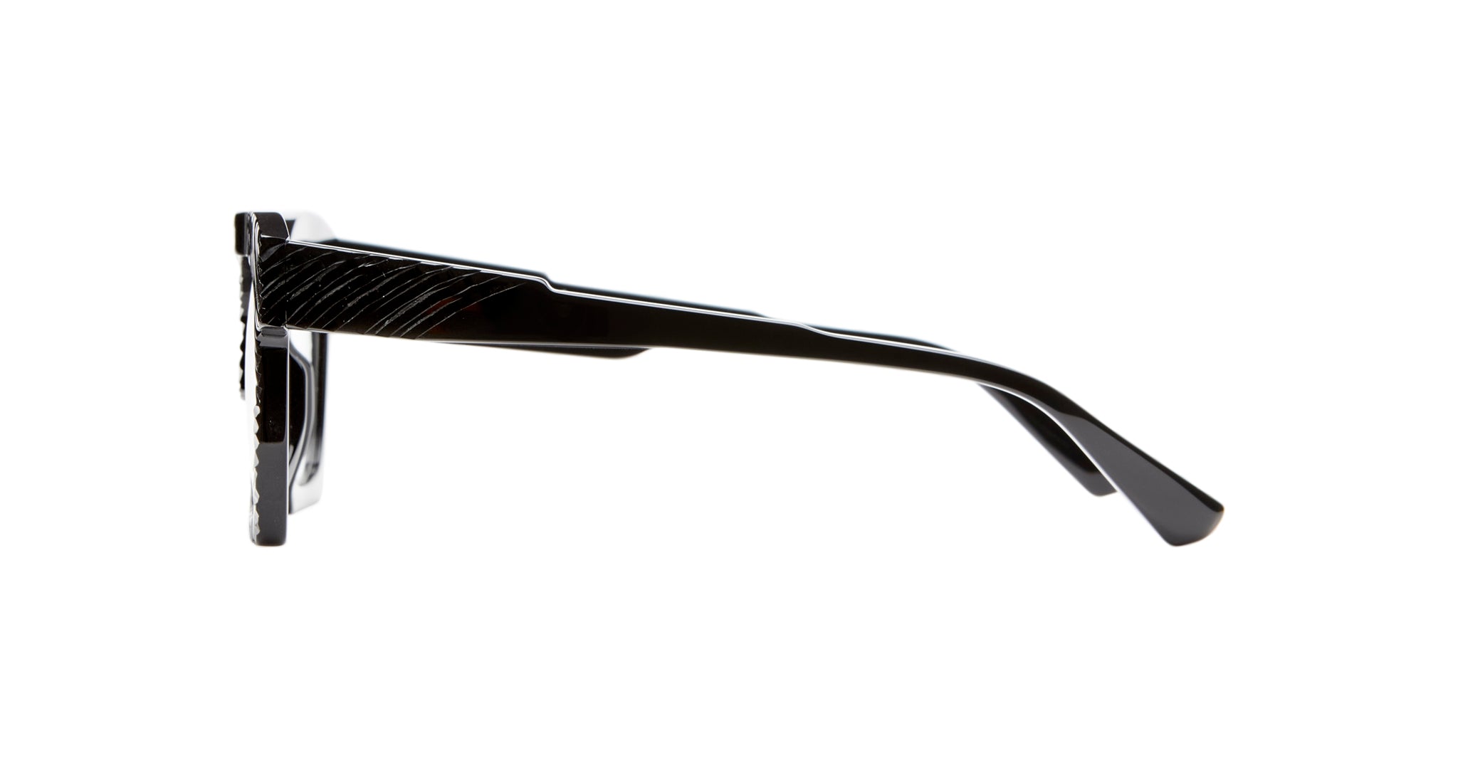 Side view of Kuboraum K5 black eyeglass frames featuring thick arms and a slightly glossy finish, isolated on a white background.