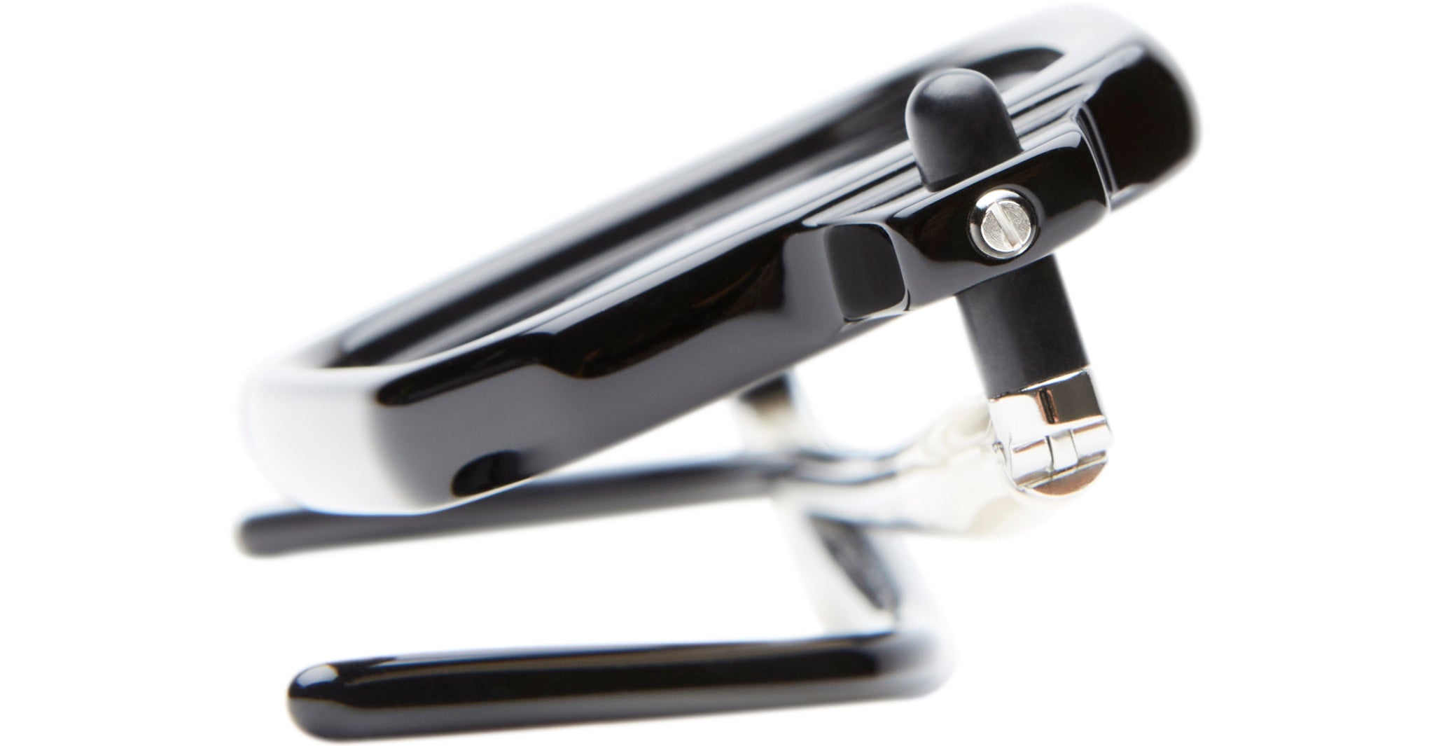 A close-up side view of the Kuboraum P23, a black smartwatch with a strap, resting on a sleek metal stand against a white background.