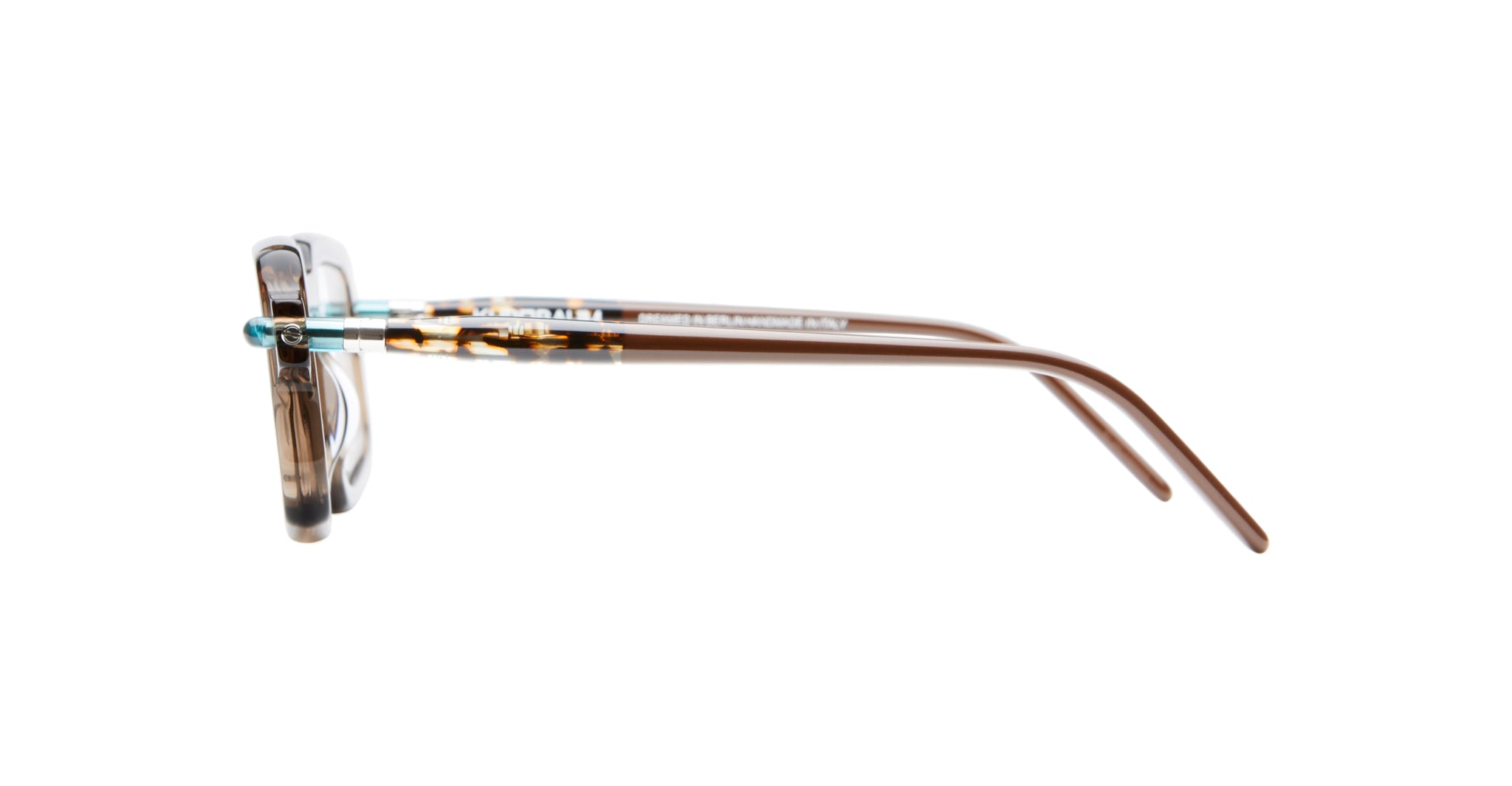 Side view of Kuboraum P23 eyeglasses with clear and brown frames and thin brown temples, displayed on a white background.