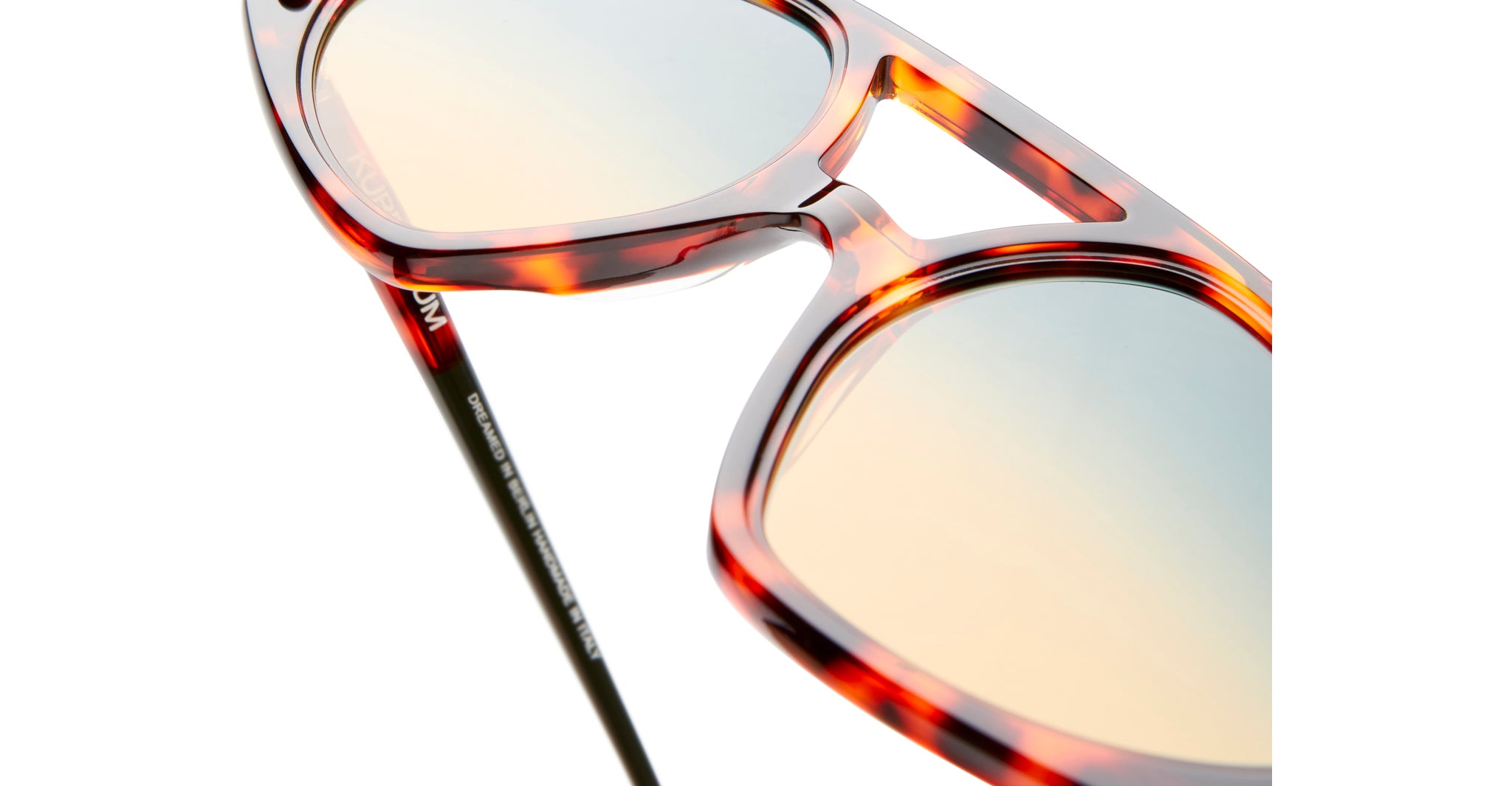 Close-up view of KUBORAUM P31 sunglasses, highlighting gradient lenses, metal hinge, and acetate frame details.