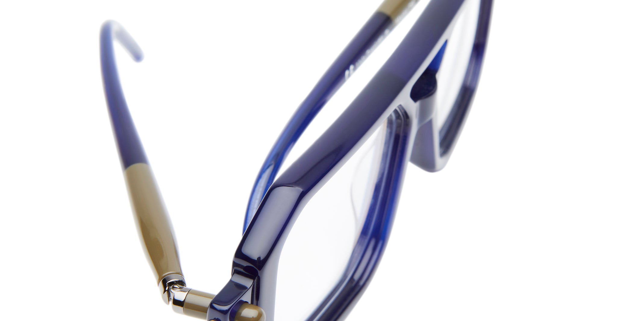 Close-up view of Kuboraum P8 blue eyeglass frames with clear lenses and brown-accented temples, shown against a white background.