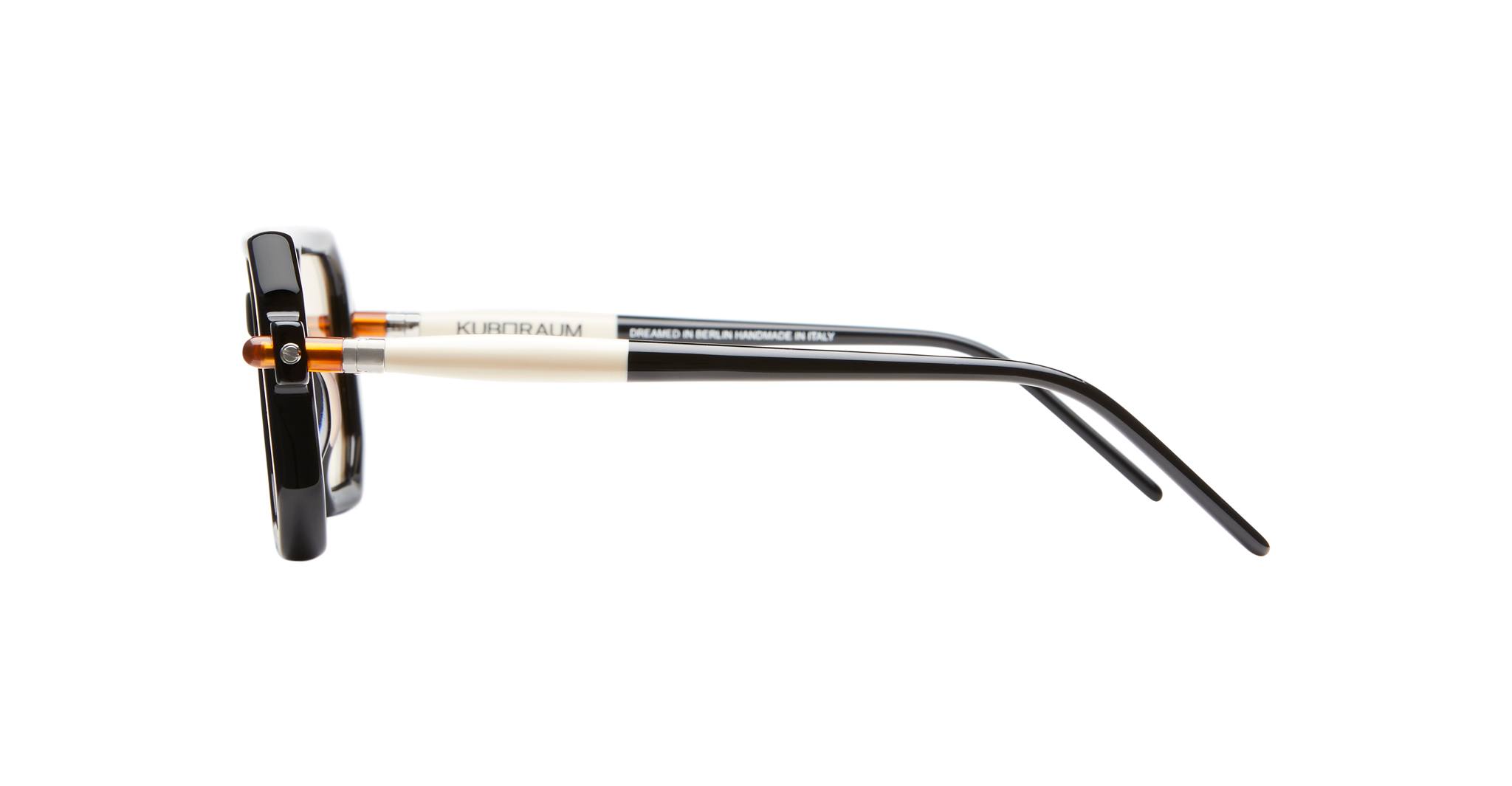 Side view of Kuboraum P8 eyeglasses showing black frames, silver temples, hinge details, and KUBORAUM logo on the arms.