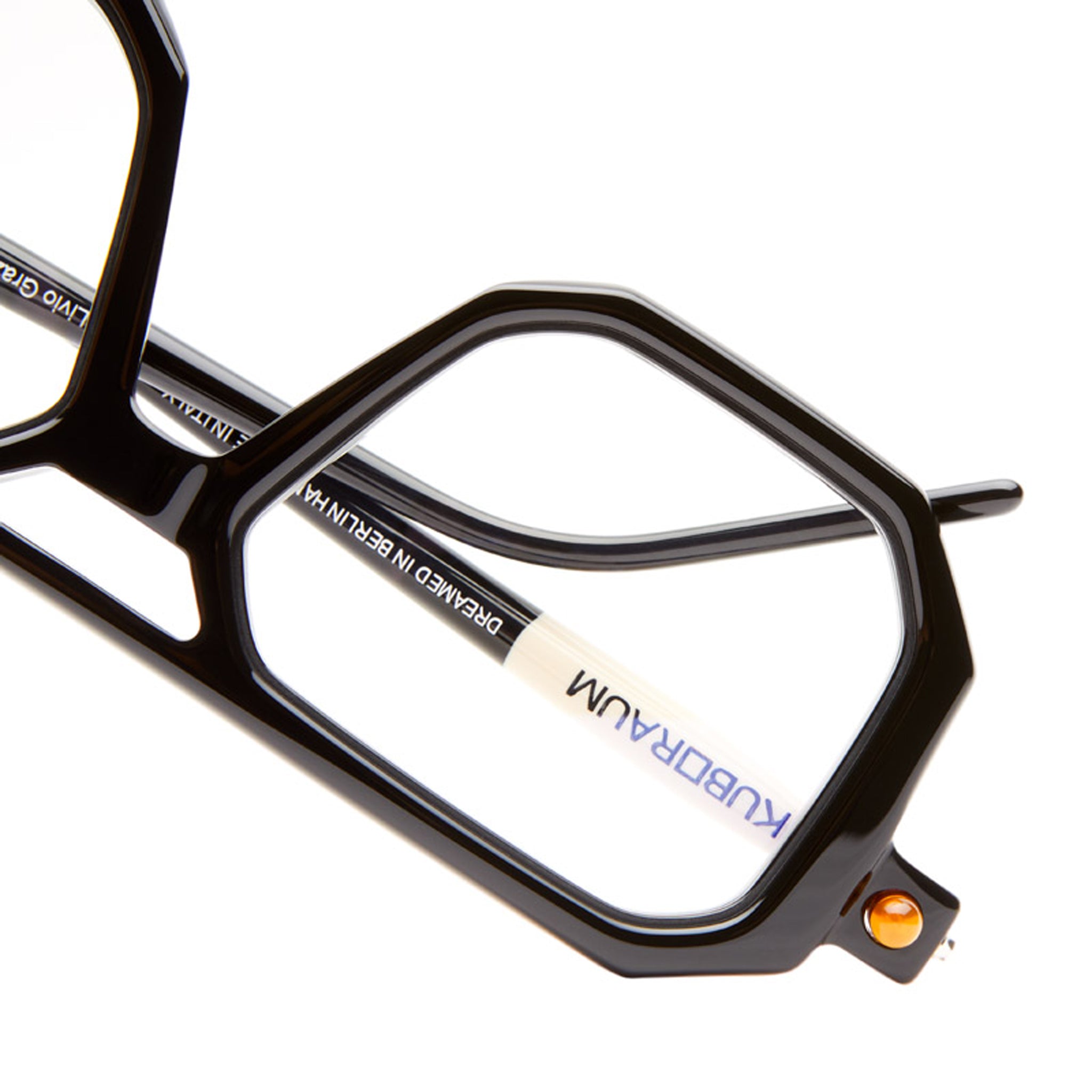 Close-up of Kuboraum P8 black geometric eyeglasses, showing KUBORAUM branding on the inner arm.