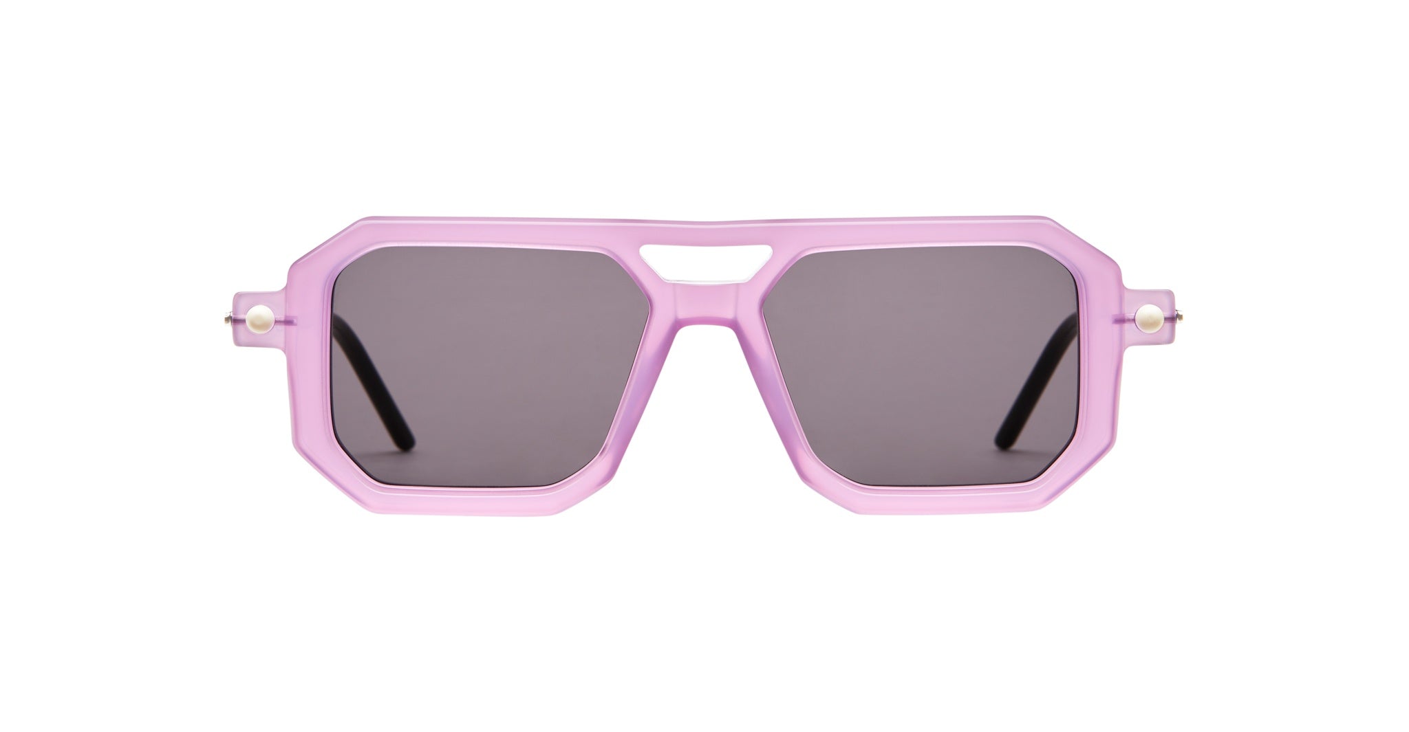 Kuboraum P8 sunglasses by KUBORAUM, shown from the front, feature pink geometric frames, UV dark lenses, and black arms.
