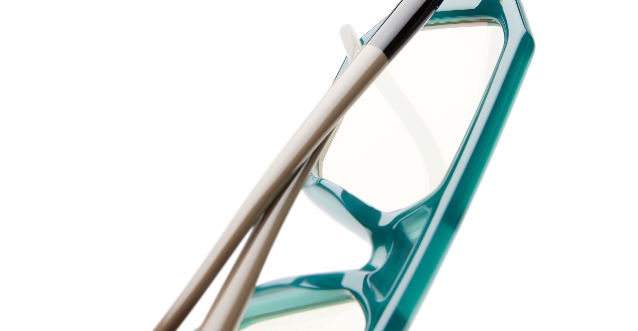 Kuboraum P8 eyeglasses by KUBORAUM, teal frame with cream arms and clear lenses, displayed at a diagonal angle.