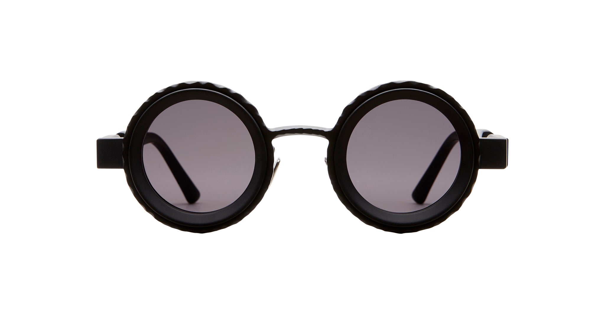 Kuboraum Z3 sunglasses by KUBORAUM, round black frames with polarized dark lenses, shown from the front.