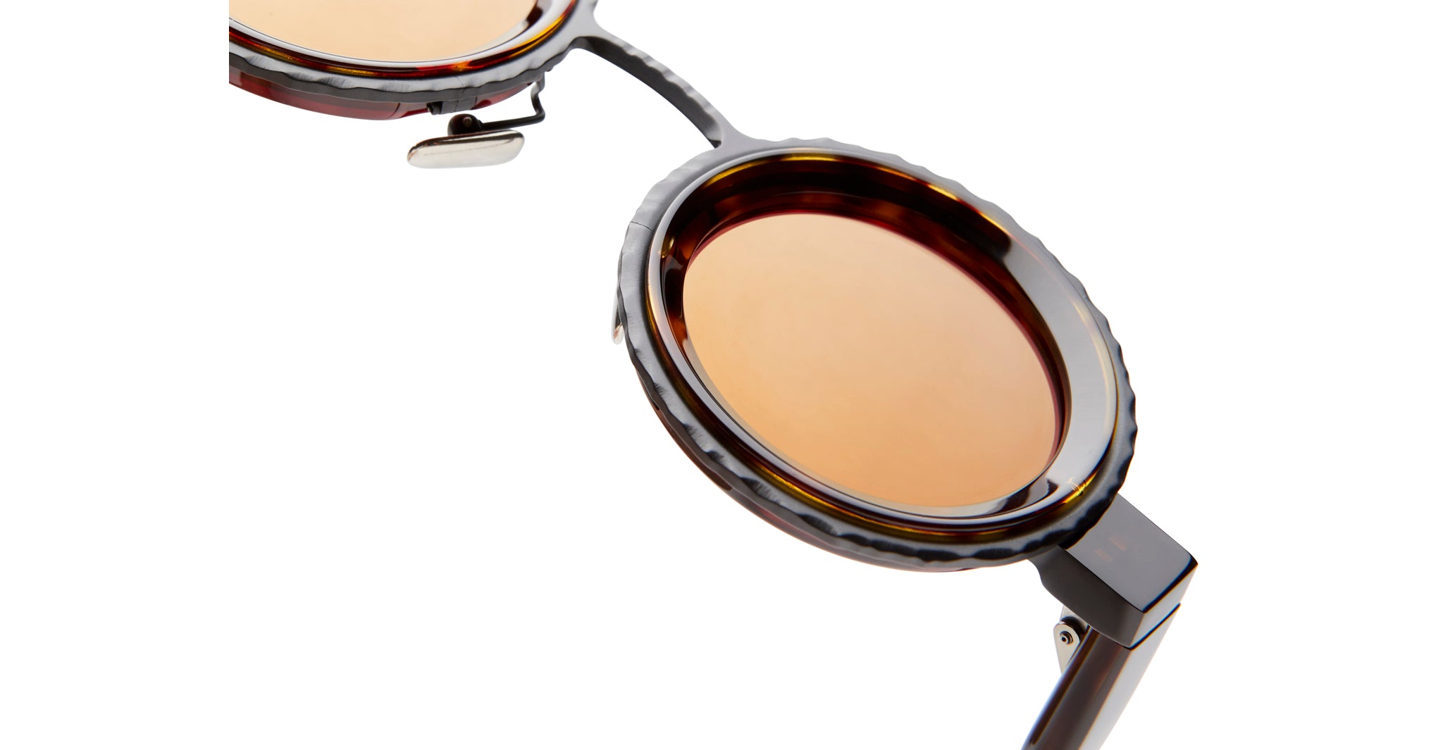 Close-up of Kuboraum Z3 round sunglasses showing round brown lenses and textured dark frame, front-facing angle.