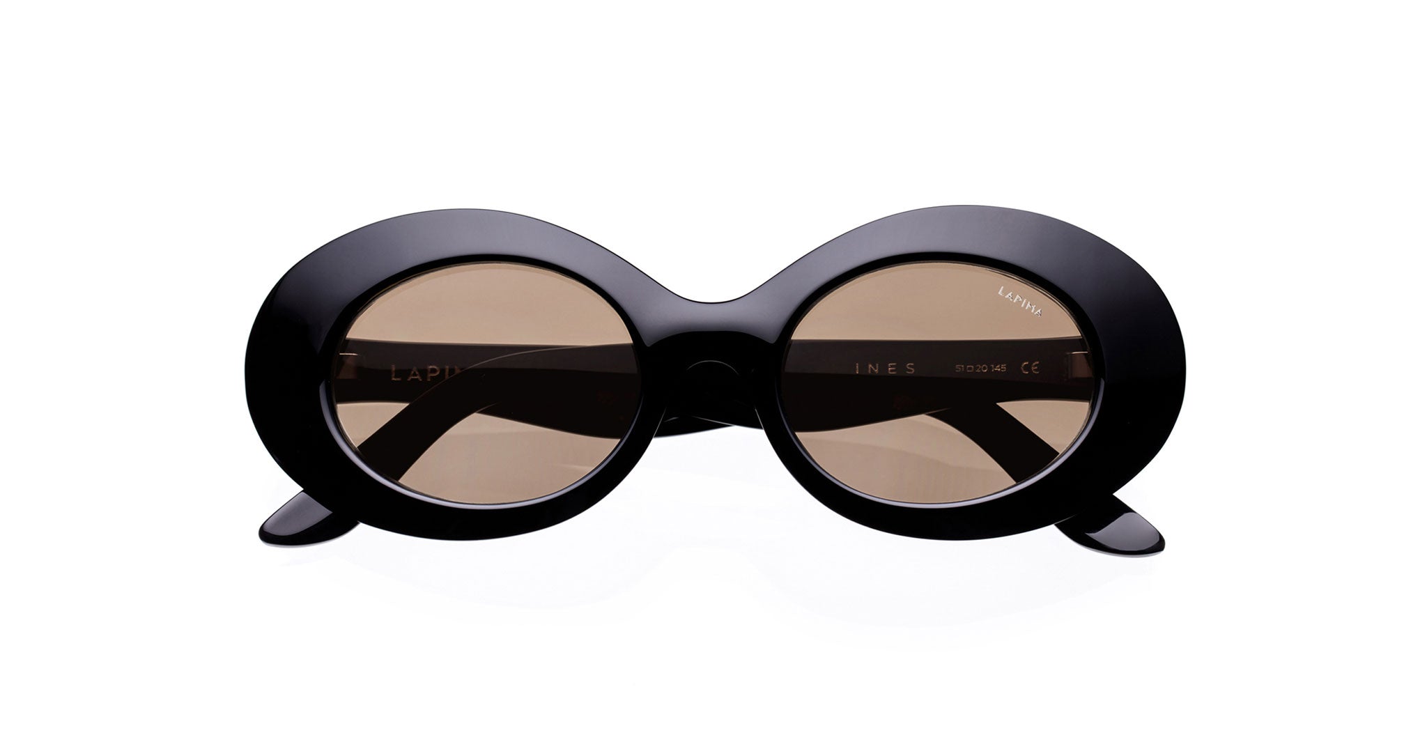 The Lapima Ines sunglasses feature thick black round frames and brown lenses, shown against a white background.