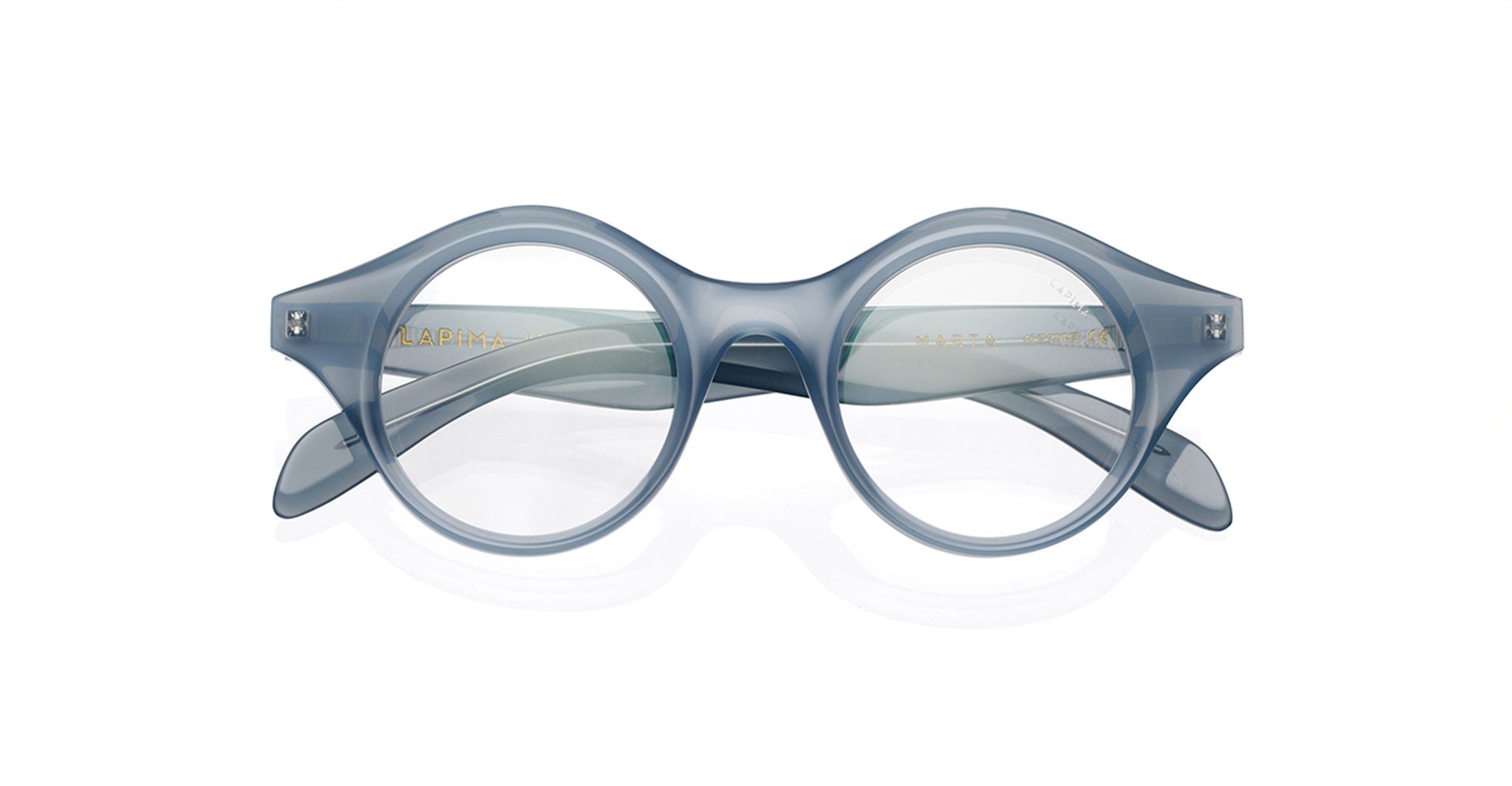 Lapima Marta eyeglasses in round, blue translucent acetate with a thick frame, shown from the front on a white background.