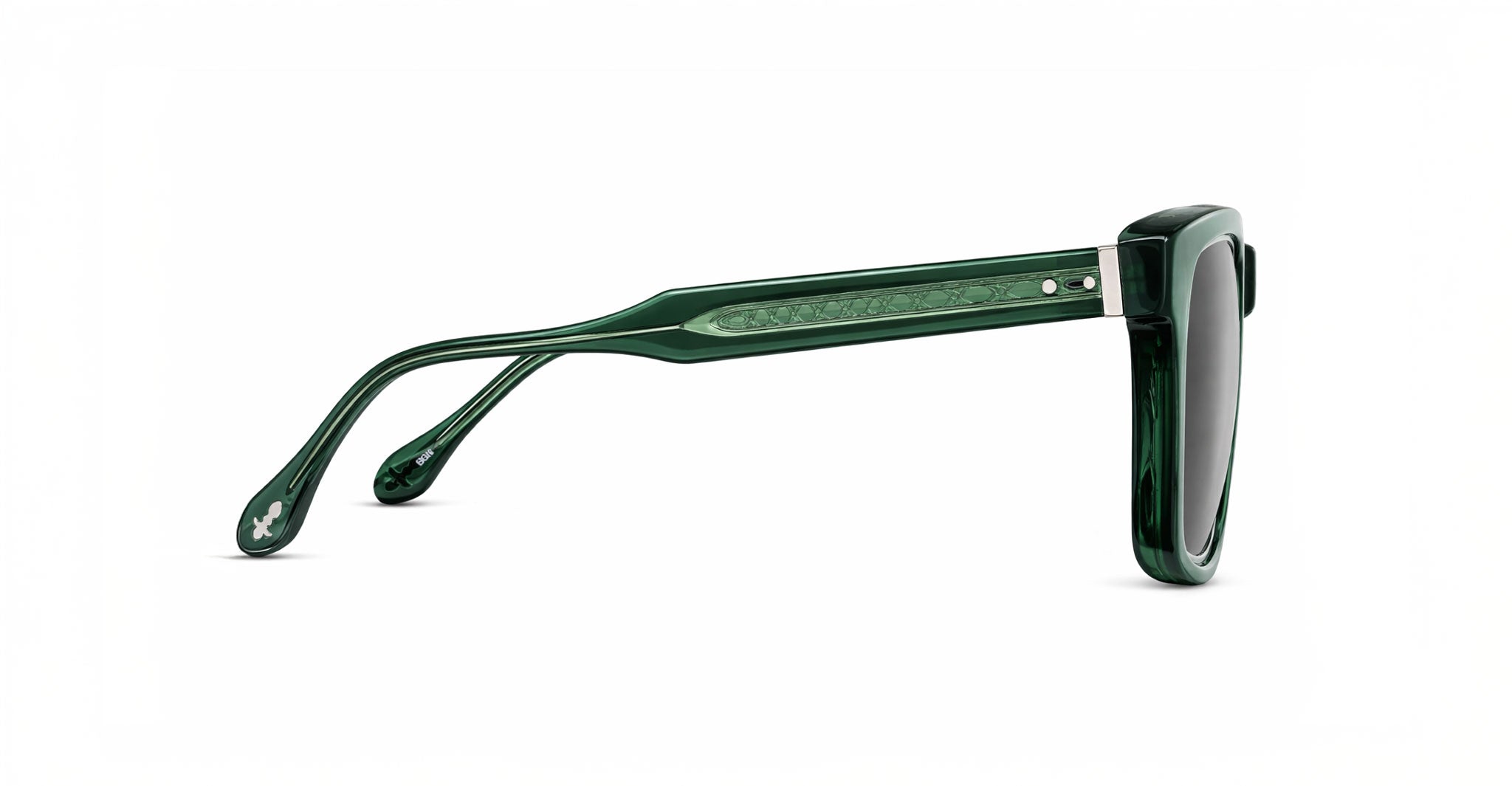 Side view of Matsuda M1040 stylish green sunglasses with dark lenses, a thick translucent frame, detailed arms, and a small decorative emblem near the temple tip.