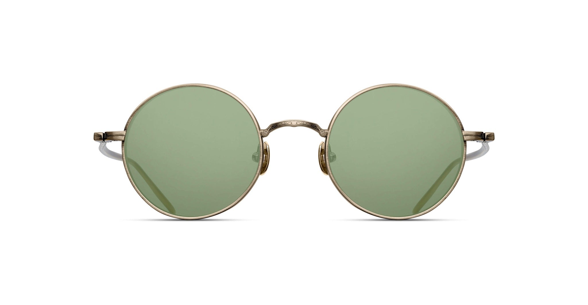 The Matsuda M3087 features round green-tinted lenses and slim metallic gold frames, displayed from the front against a white background.