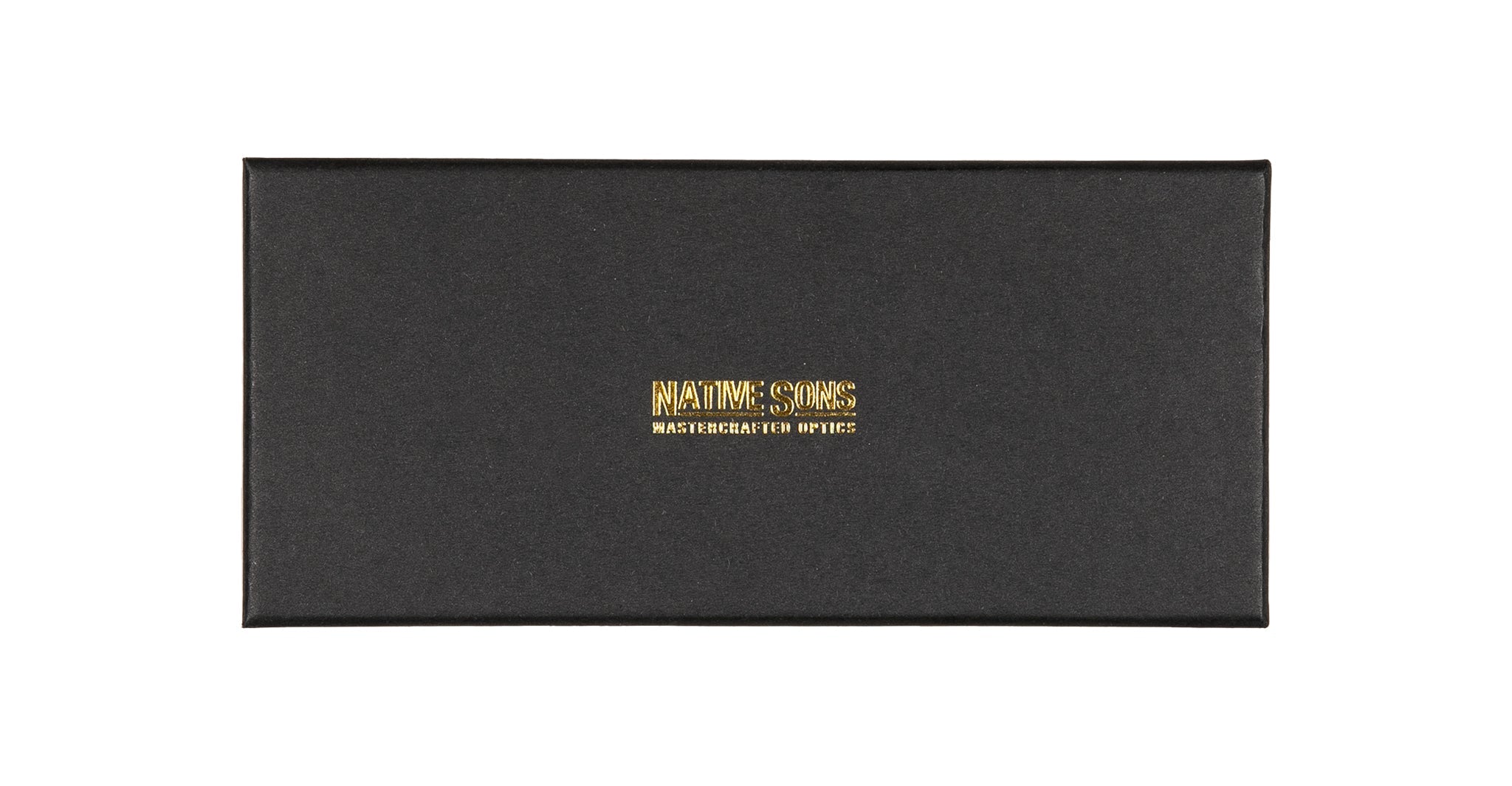 A black rectangular box with gold “Native Sons Mastercrafted Optics” text on the lid, embodying the refined style of Casinola x Native Sons “The E’s” (The Eddie) sunglasses by Native Sons.