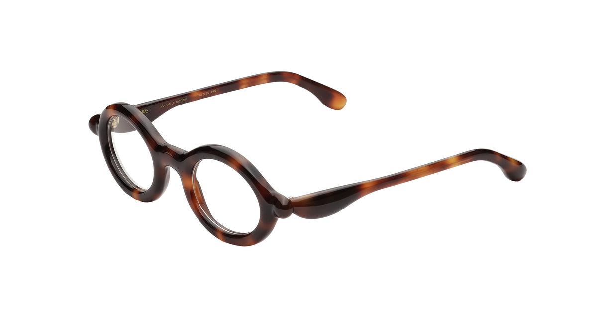 Paloceras R2 oval optical eyeglasses in Havana Gold, a translucent dark tortoise acetate with warm amber and chestnut tones, angled view