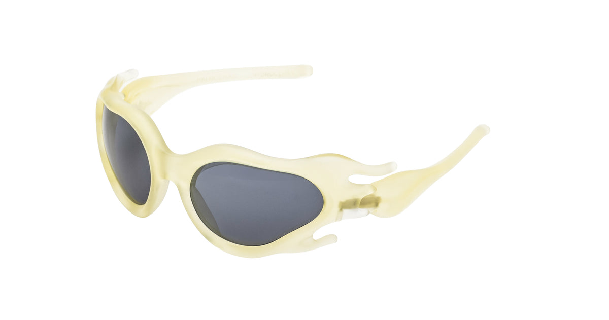 Paloceras Hydroceras sculpted organic oval sunglasses in Oneryth, with a translucent pale yellow frame and dark gray lenses, angled view.