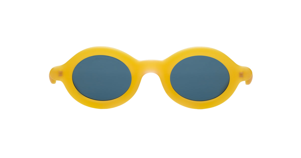 Paloceras Nouvelle Fiction R2 Melon Dust sunglasses in a warm translucent golden yellow frame with thick rounded oval rims and dark blue lenses, front view