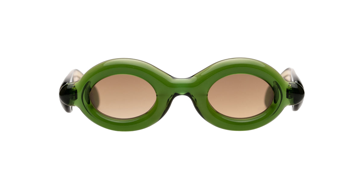 Oval Paloceras sunglasses with a translucent olive green frame and brown-tinted lenses