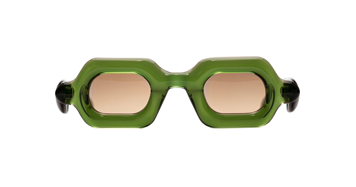 Hexagonal Paloceras Pebble SX sunglasses with a translucent olive green frame and light brown tinted lenses.