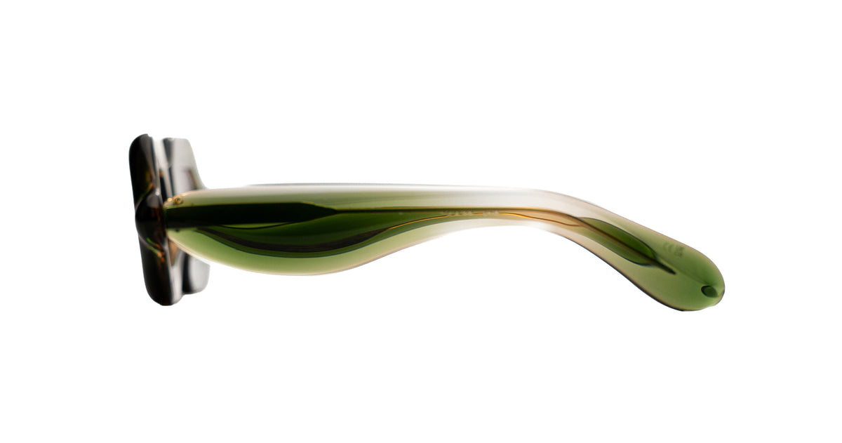A translucent olive green Paloceras Pebble frame seen from the side, showing the curves of the voluminous temple