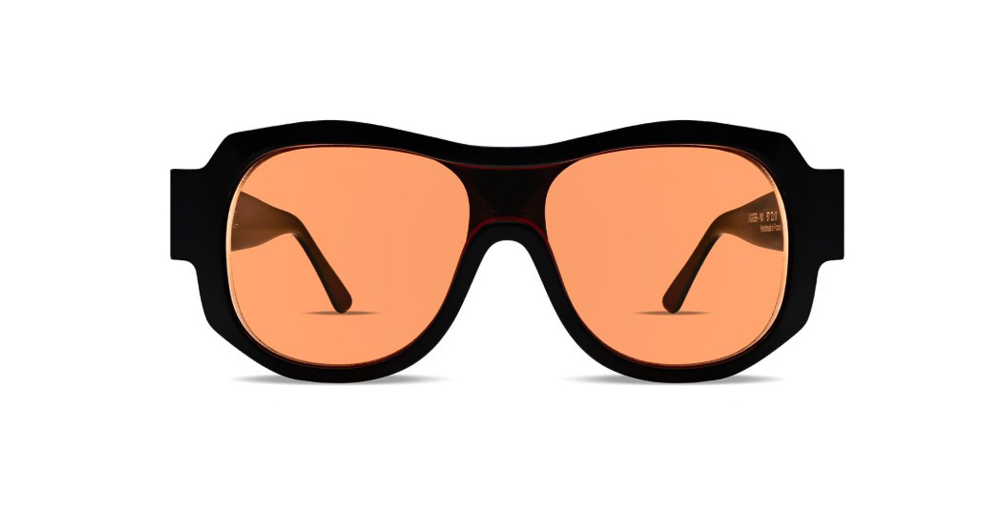 Front View of Thierry Lasry Jagger Sunglass in Color Black with Orange Lenses