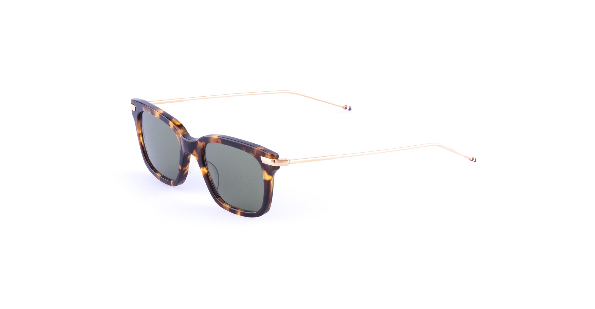Thom Browne 701 sunglasses, rectangular tortoiseshell frame with thin gold metal arms, shown from a front angle.