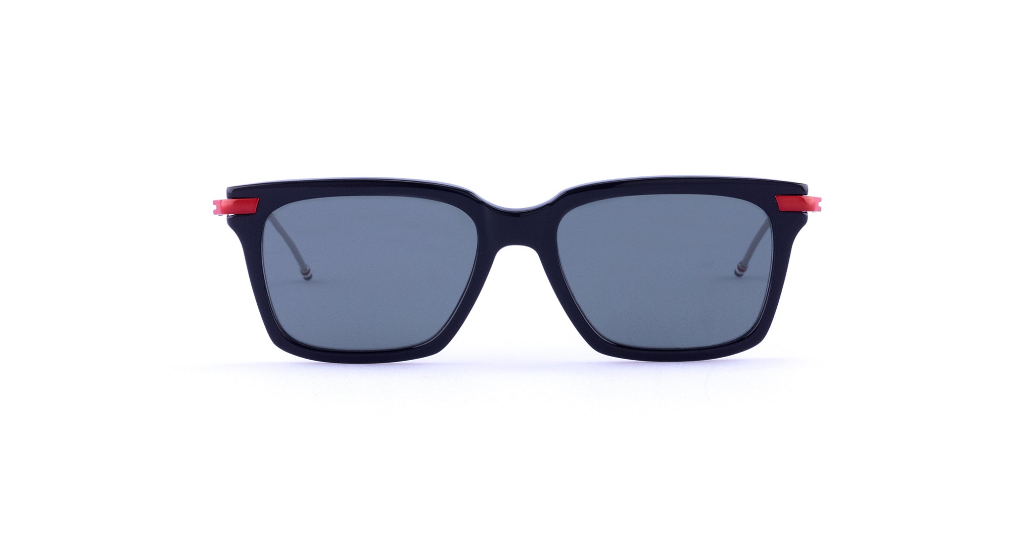 Thom Browne 701 black square sunglasses with dark UV lenses and red accents, front-facing view.