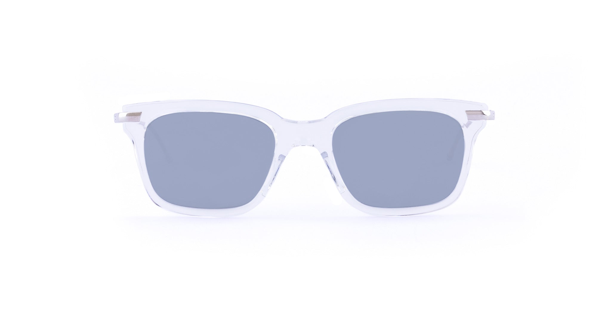 Front view of Thom Browne 701 sunglasses featuring blue-tinted lenses and clear frames.