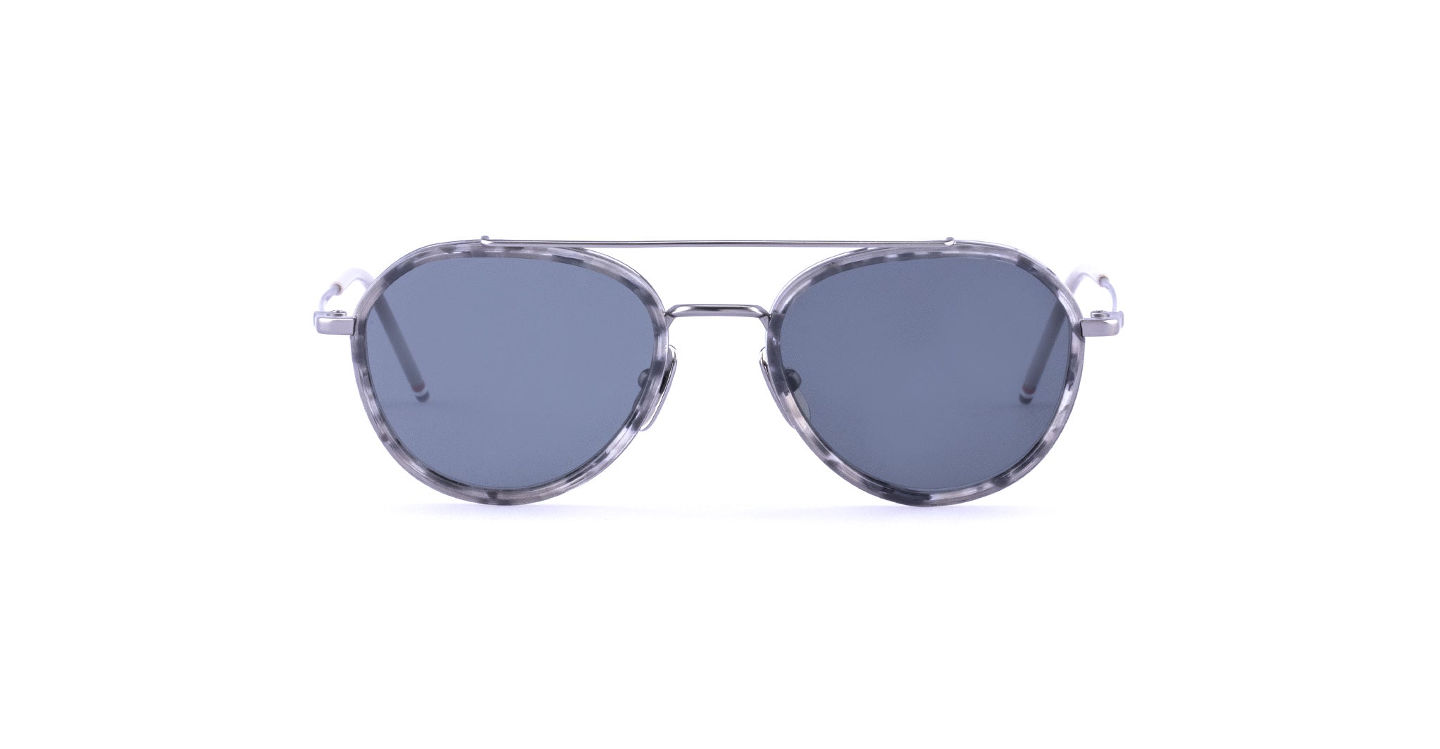 A pair of aviator-style sunglasses with dark gray lenses and a clear, gray-tinted frame, viewed from the front.